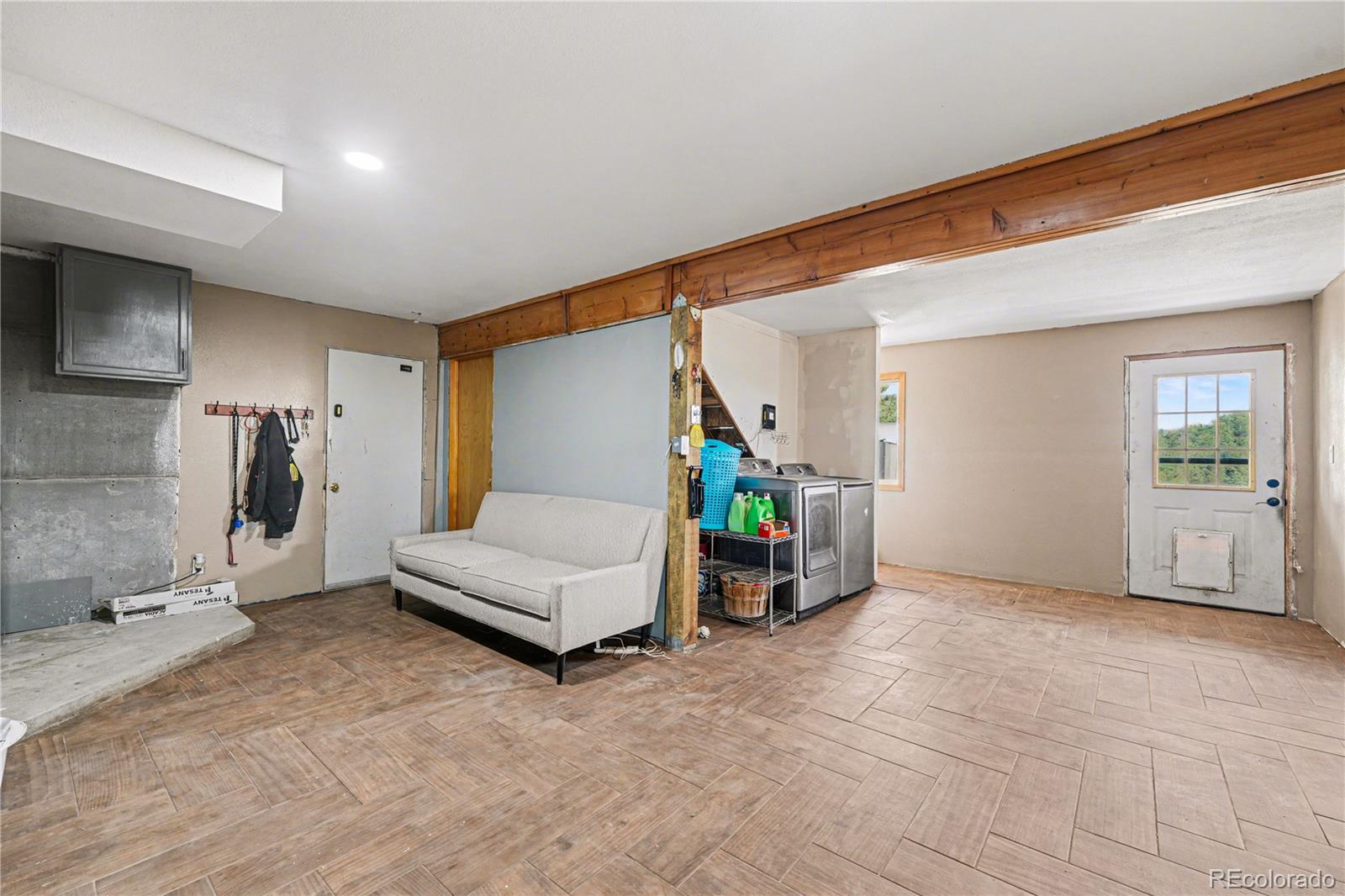 319 Springmeadow Way Red Feather Lakes, CO 80545 - Photo 14 of 30 a view of a livingroom with furniture and a flat screen tv