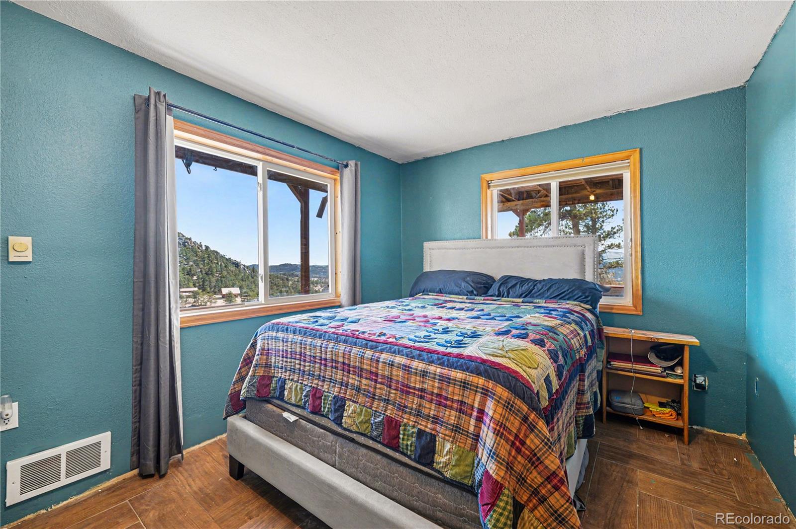 319 Springmeadow Way Red Feather Lakes, CO 80545 - Photo 17 of 30 a bedroom with a bed and a window