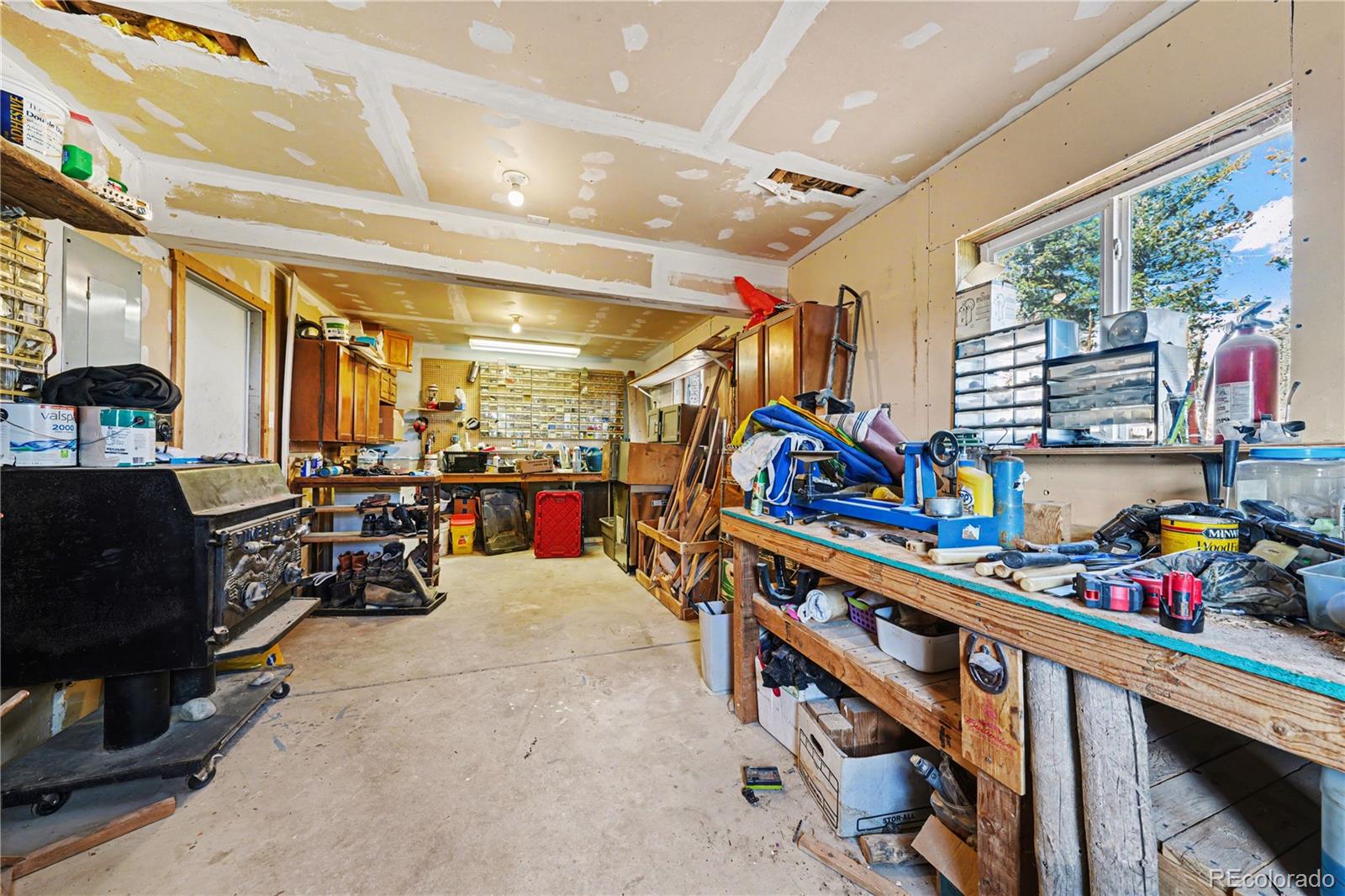 319 Springmeadow Way Red Feather Lakes, CO 80545 - Photo 19 of 30 a storage room with lots of clutter and lots of furniture