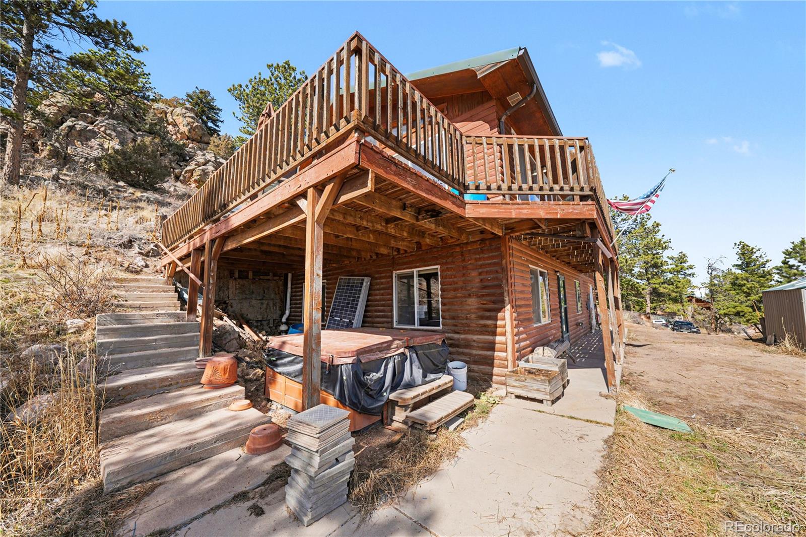319 Springmeadow Way Red Feather Lakes, CO 80545 - Photo 20 of 30 a view of a house with wooden deck
