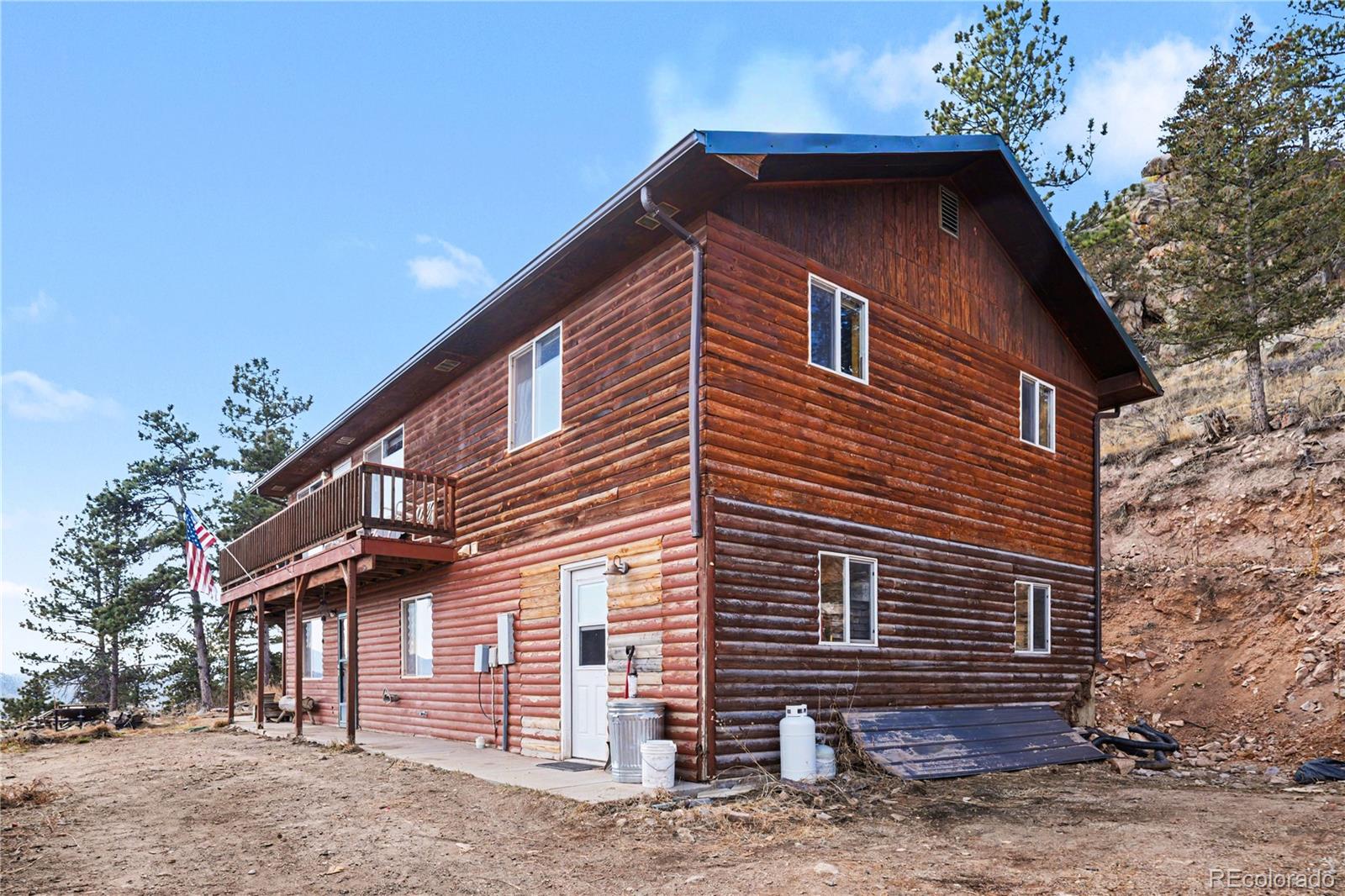 319 Springmeadow Way Red Feather Lakes, CO 80545 - Photo 22 of 30 a front view of a house with a yard