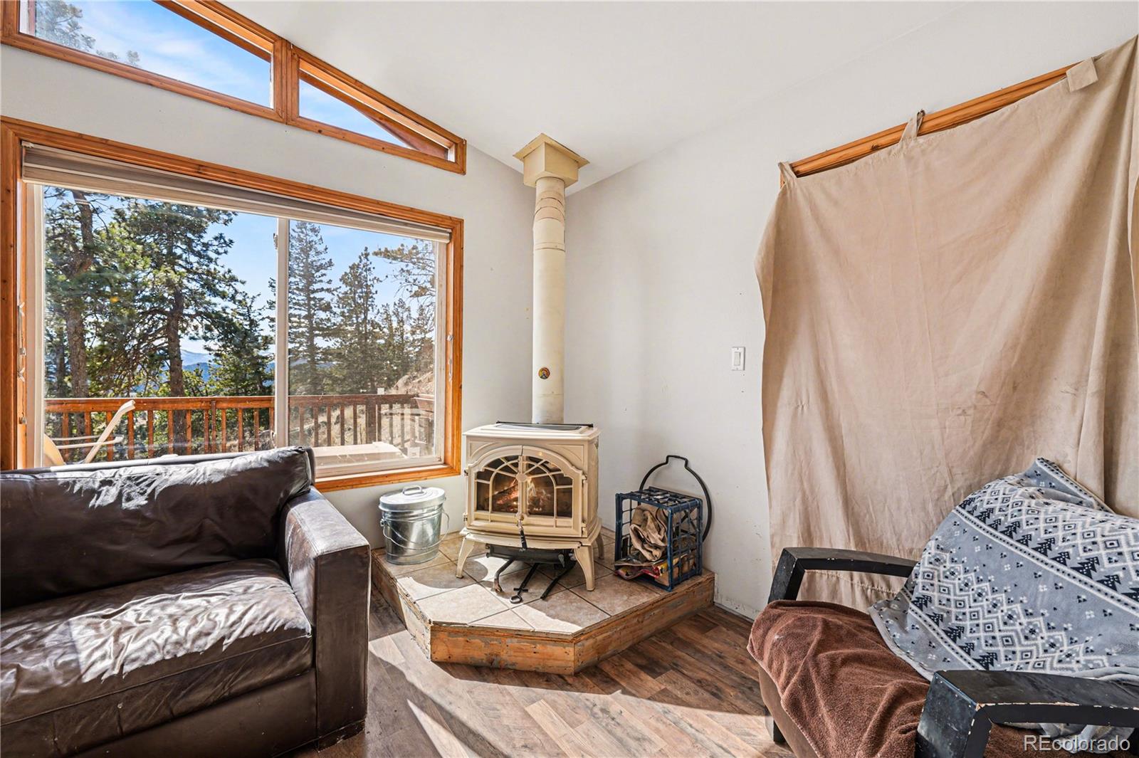 319 Springmeadow Way Red Feather Lakes, CO 80545 - Photo 5 of 30 a living room with furniture and a large window