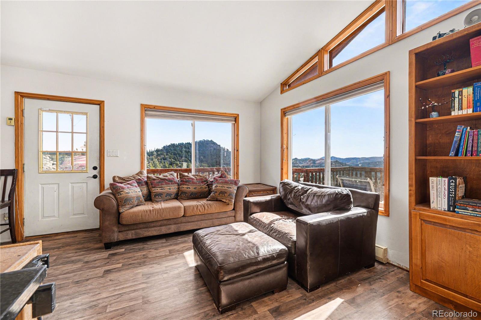 319 Springmeadow Way Red Feather Lakes, CO 80545 - Photo 6 of 30 a living room with furniture and a large window