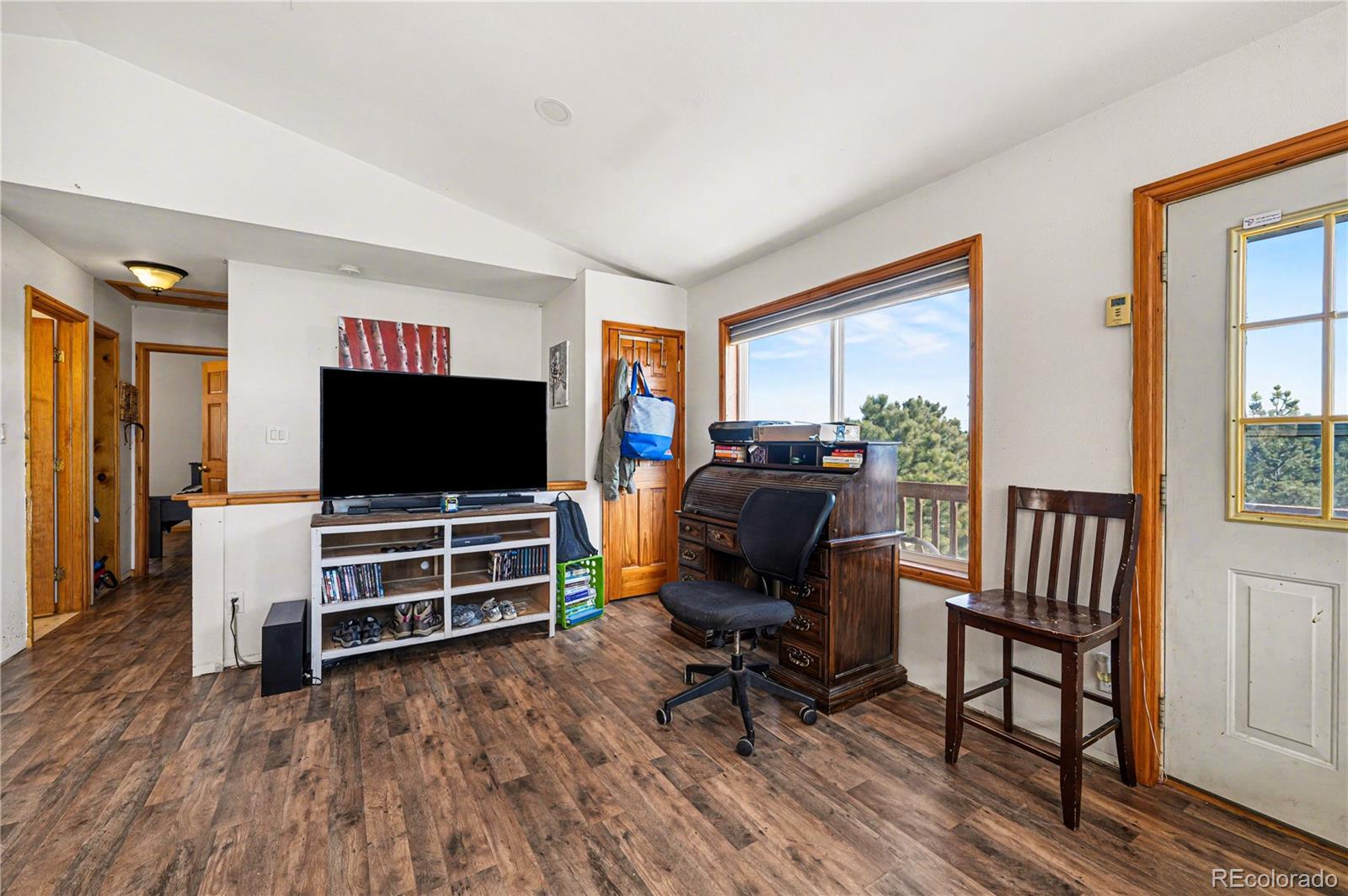 319 Springmeadow Way Red Feather Lakes, CO 80545 - Photo 7 of 30 a living room with furniture and a flat screen tv