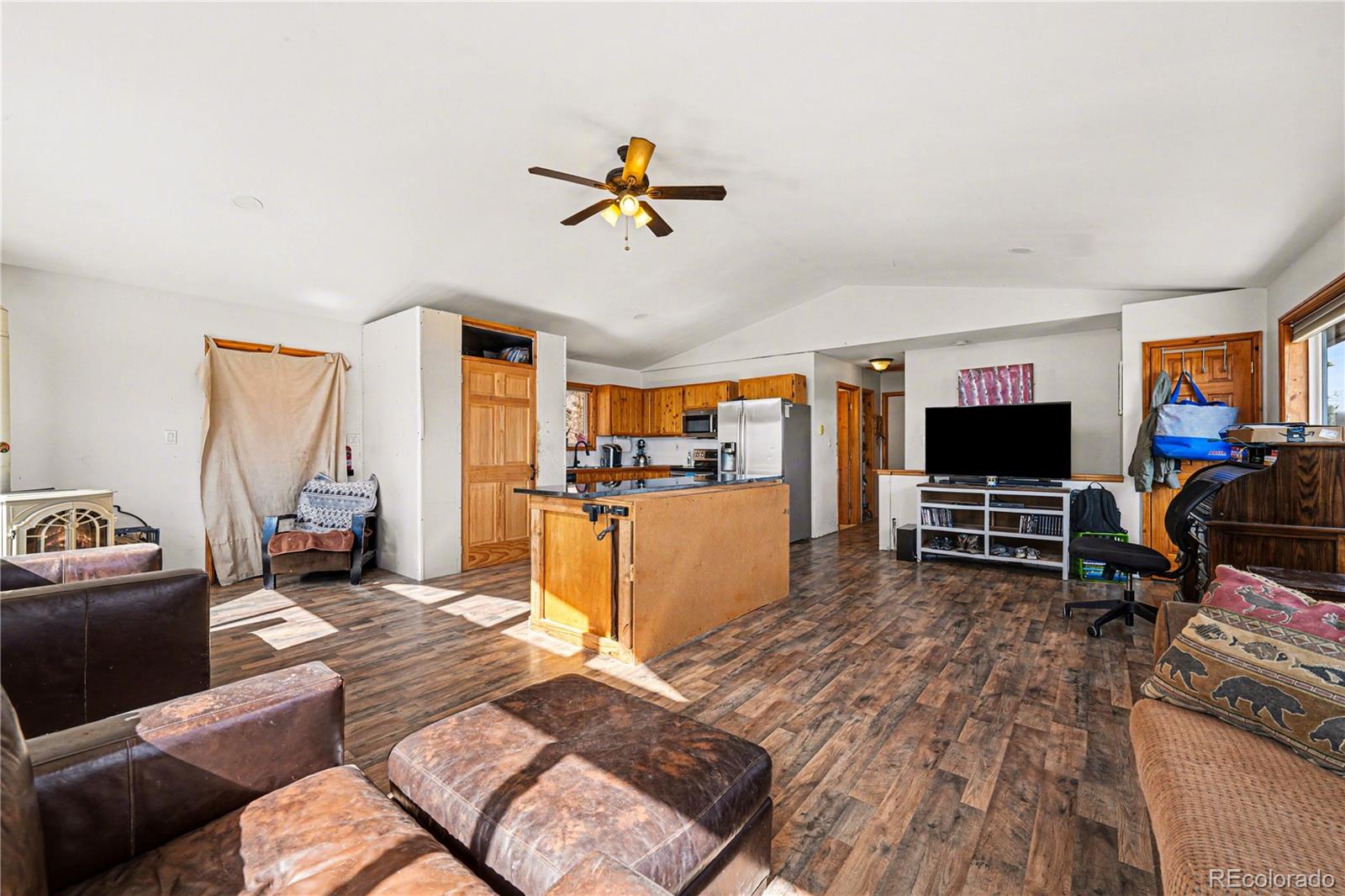319 Springmeadow Way Red Feather Lakes, CO 80545 - Photo 9 of 30 a living room with furniture and a flat screen tv