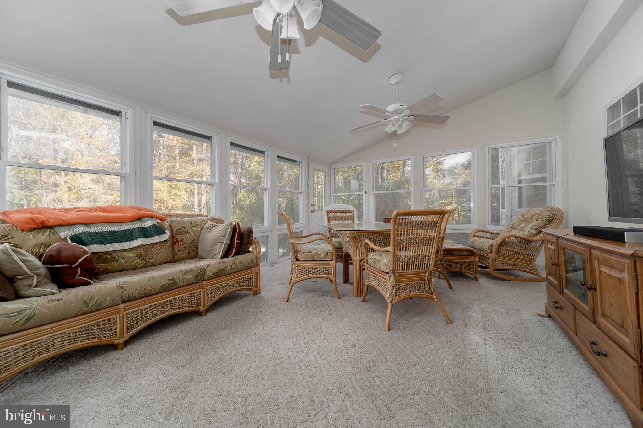 620 Small Reward Road Huntingtown, MD 20639 - Photo 11 of 33 a living room with furniture ceiling fan and a window
