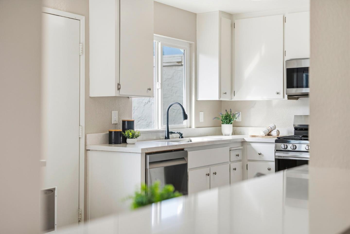 297 Perch Way Aptos, CA 95003 - Photo 36 of 42 a kitchen with appliances a sink and cabinets