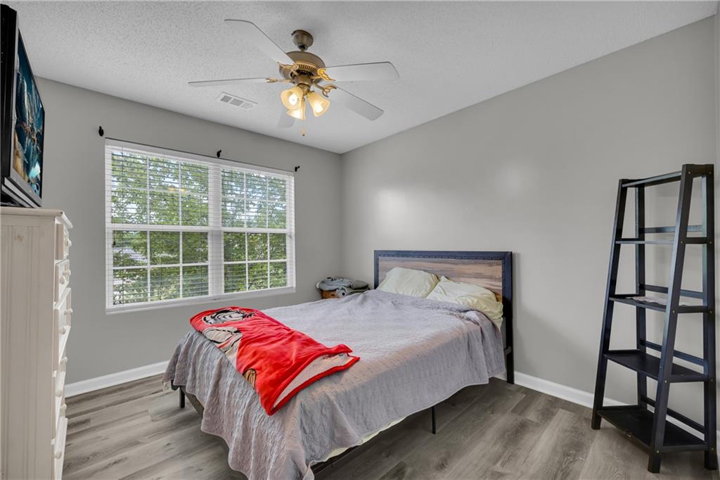 1498 Box Circle Winder, GA 30680 - Photo 27 of 56 a bedroom with a bed and a large window