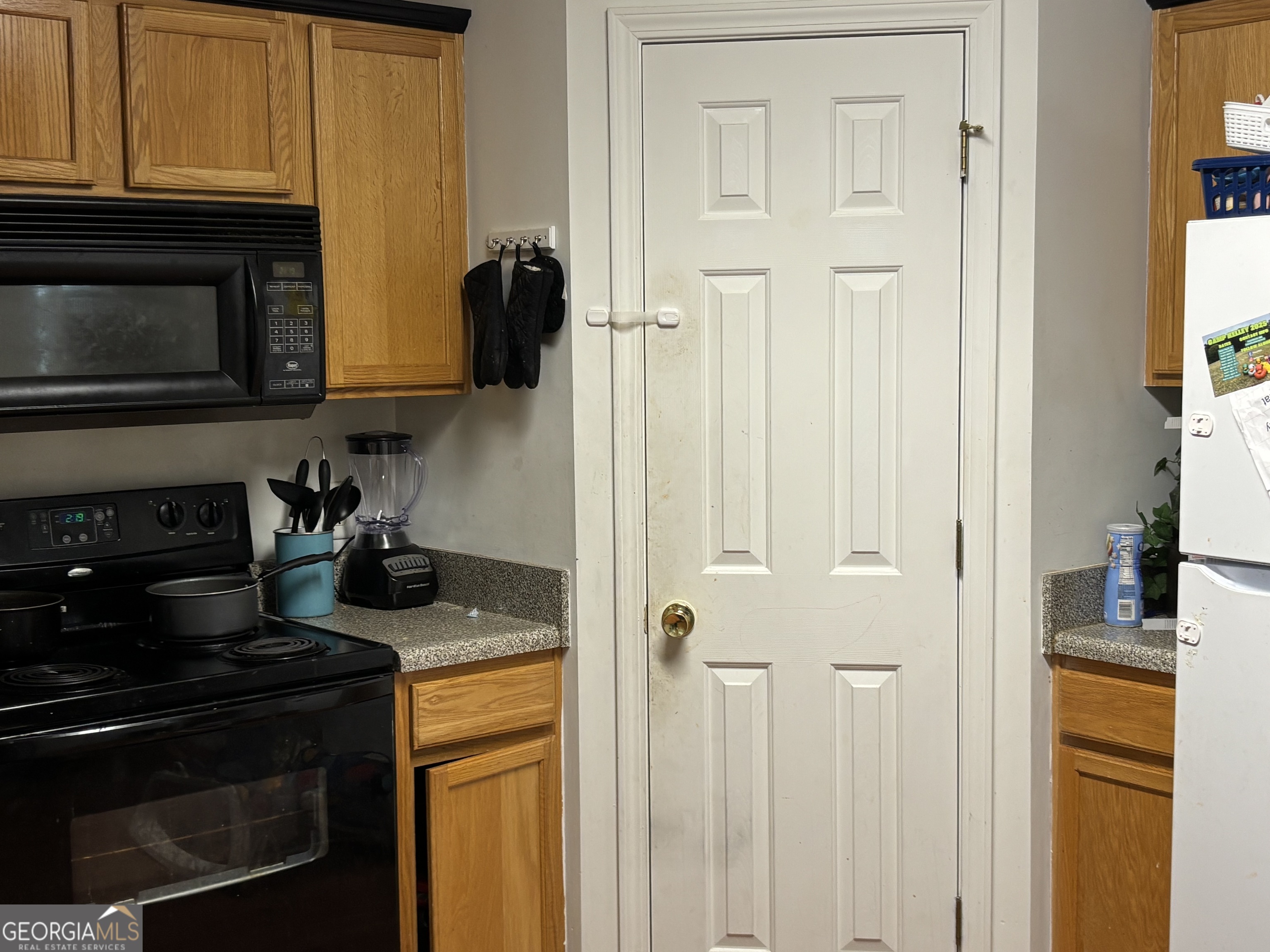 751 West Vincent Drive Athens, GA 30607 - Photo 5 of 5 a kitchen with a stove and a microwave