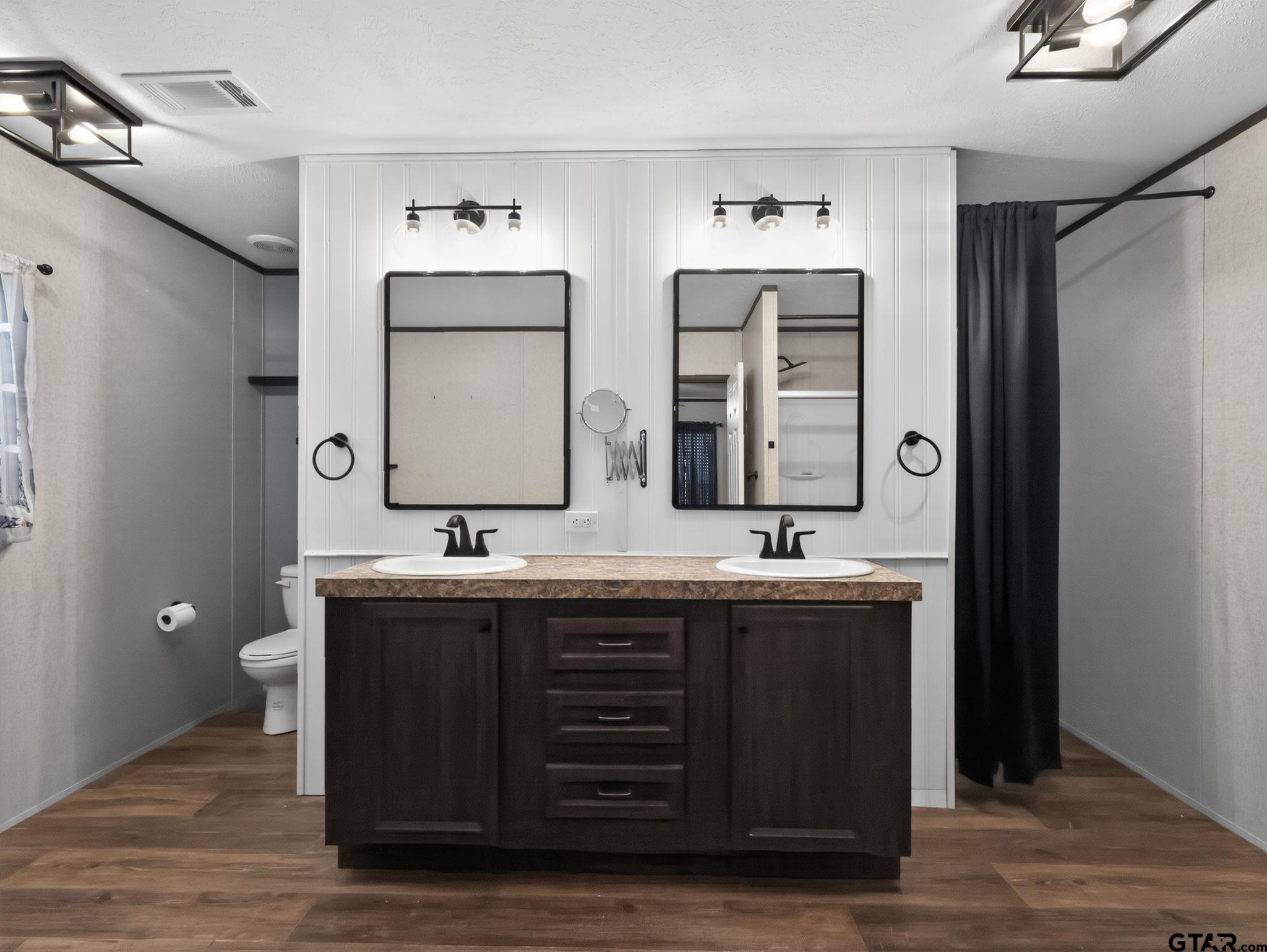 149 Running Bear Quitman, TX 75783 - Photo 21 of 31 a bathroom with double sink and a mirror