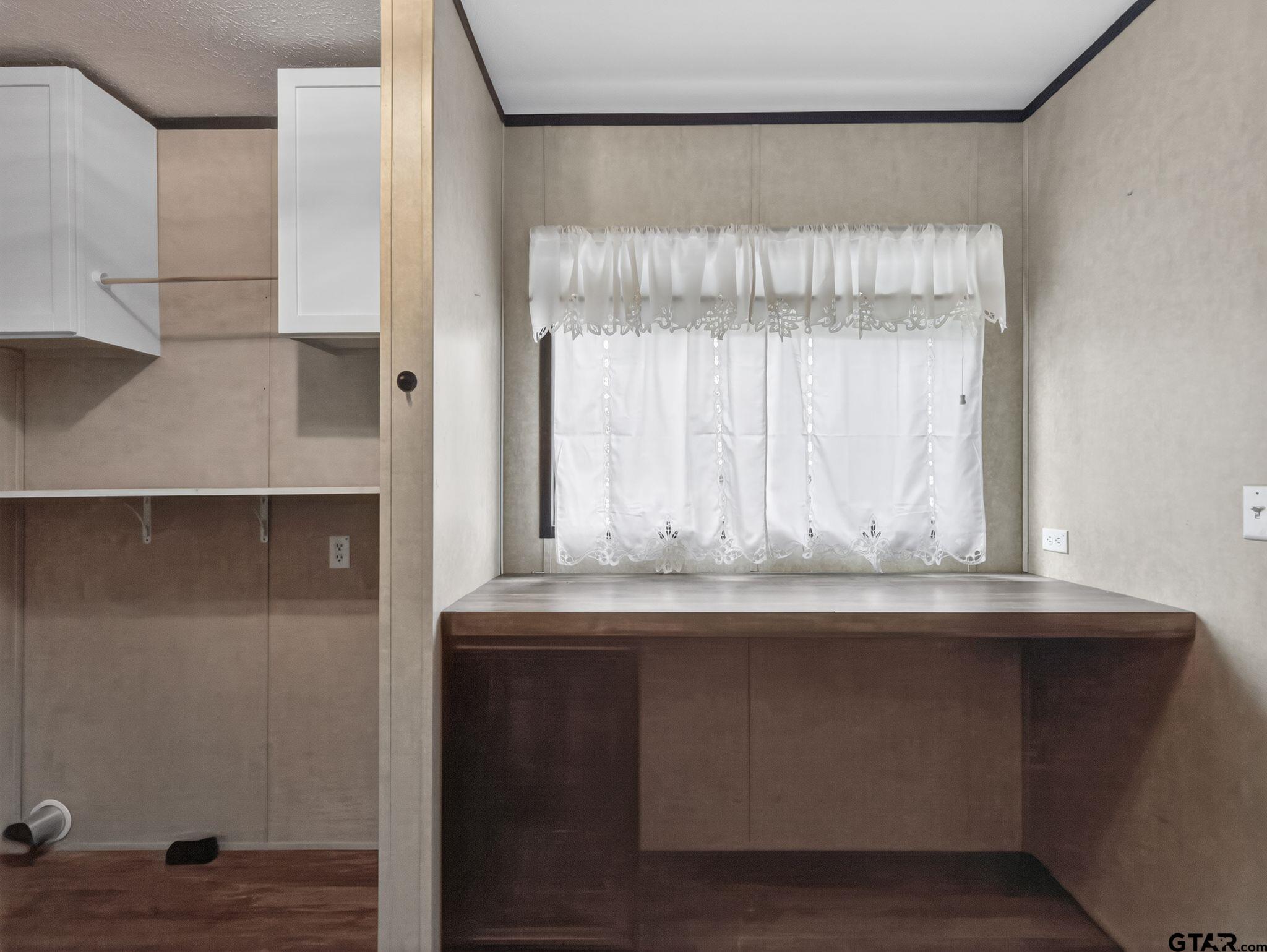 149 Running Bear Quitman, TX 75783 - Photo 28 of 31 a view of wooden floor with cabinets