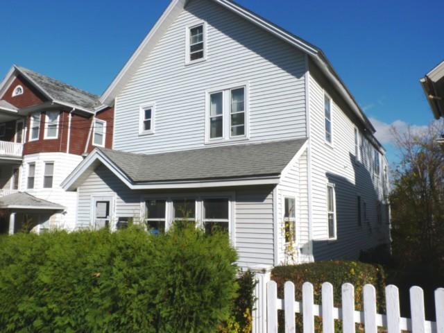 329 Wilson Street Waterbury, CT 06708 - Photo 1 of 1 a front view of a house with a porch