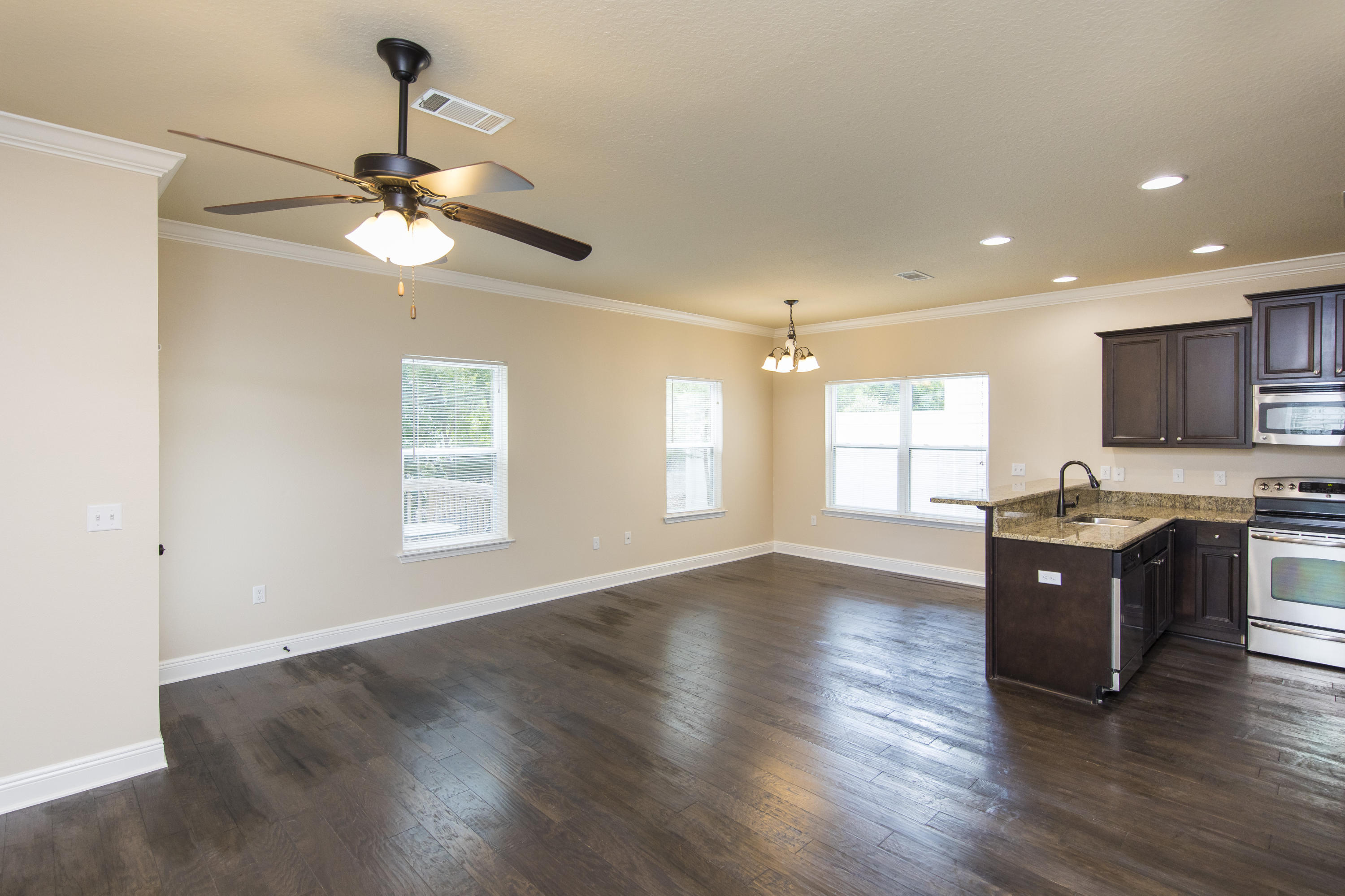48 Topside Drive Inlet Beach, FL 32461 - Photo 3 of 30 a view of an empty room with a window and wooden floor