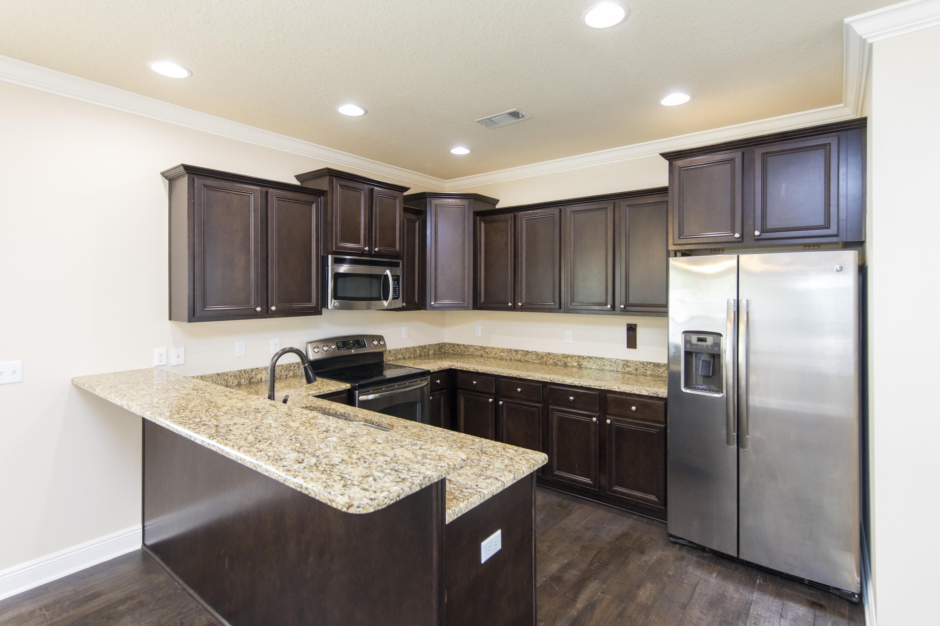 48 Topside Drive Inlet Beach, FL 32461 - Photo 6 of 30 a kitchen with kitchen island granite countertop stainless steel appliances a sink stove refrigerator and cabinets