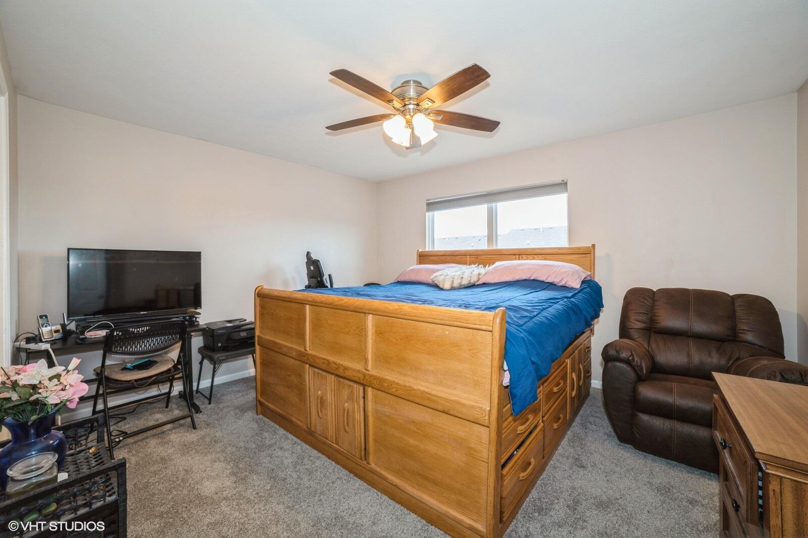 1078 East 114th Avenue Crown Point, IN 46307 - Photo 13 of 20 a living room with furniture and a flat screen tv