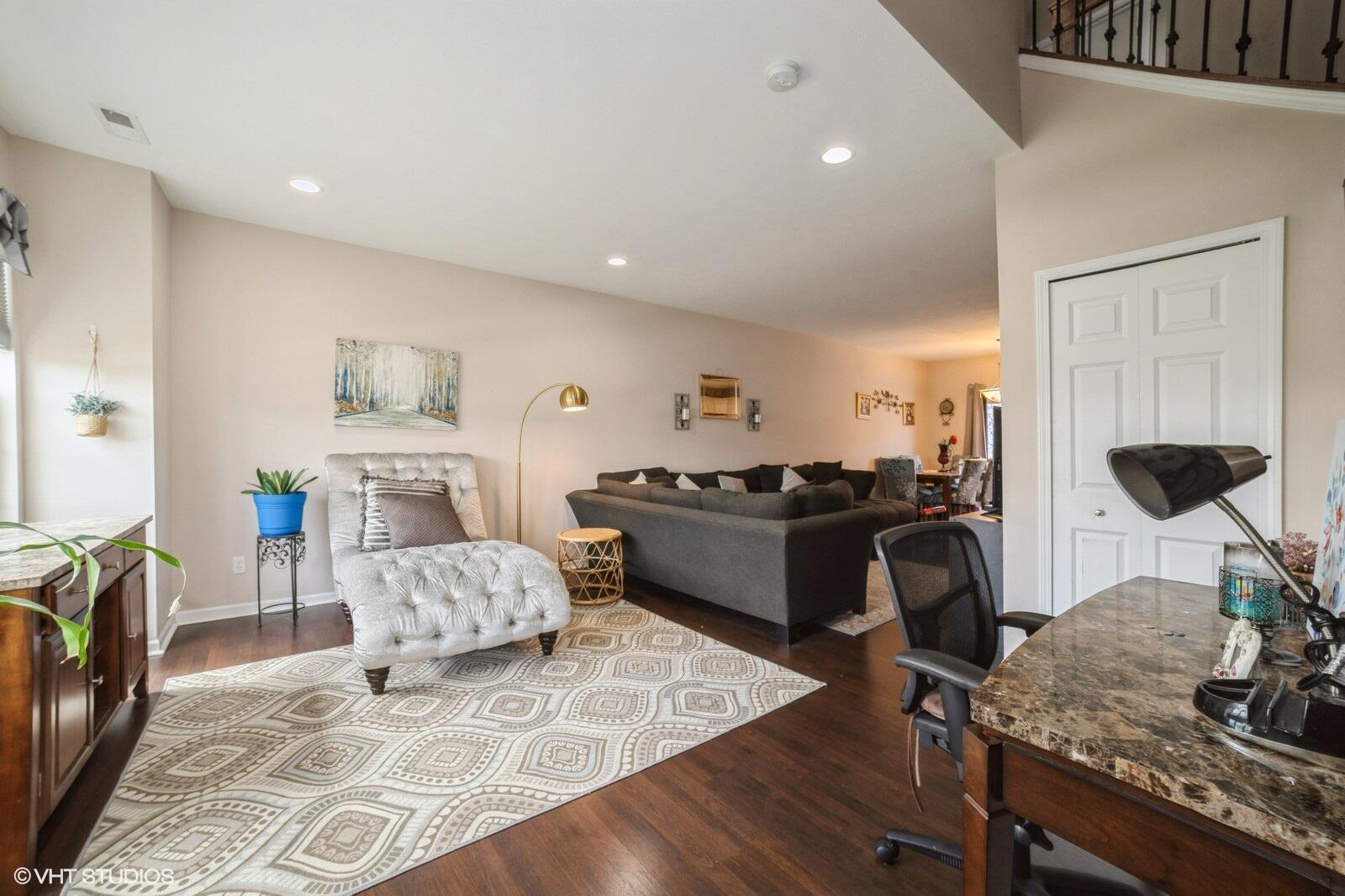 1078 East 114th Avenue Crown Point, IN 46307 - Photo 3 of 20 a living room with furniture and a wooden floor
