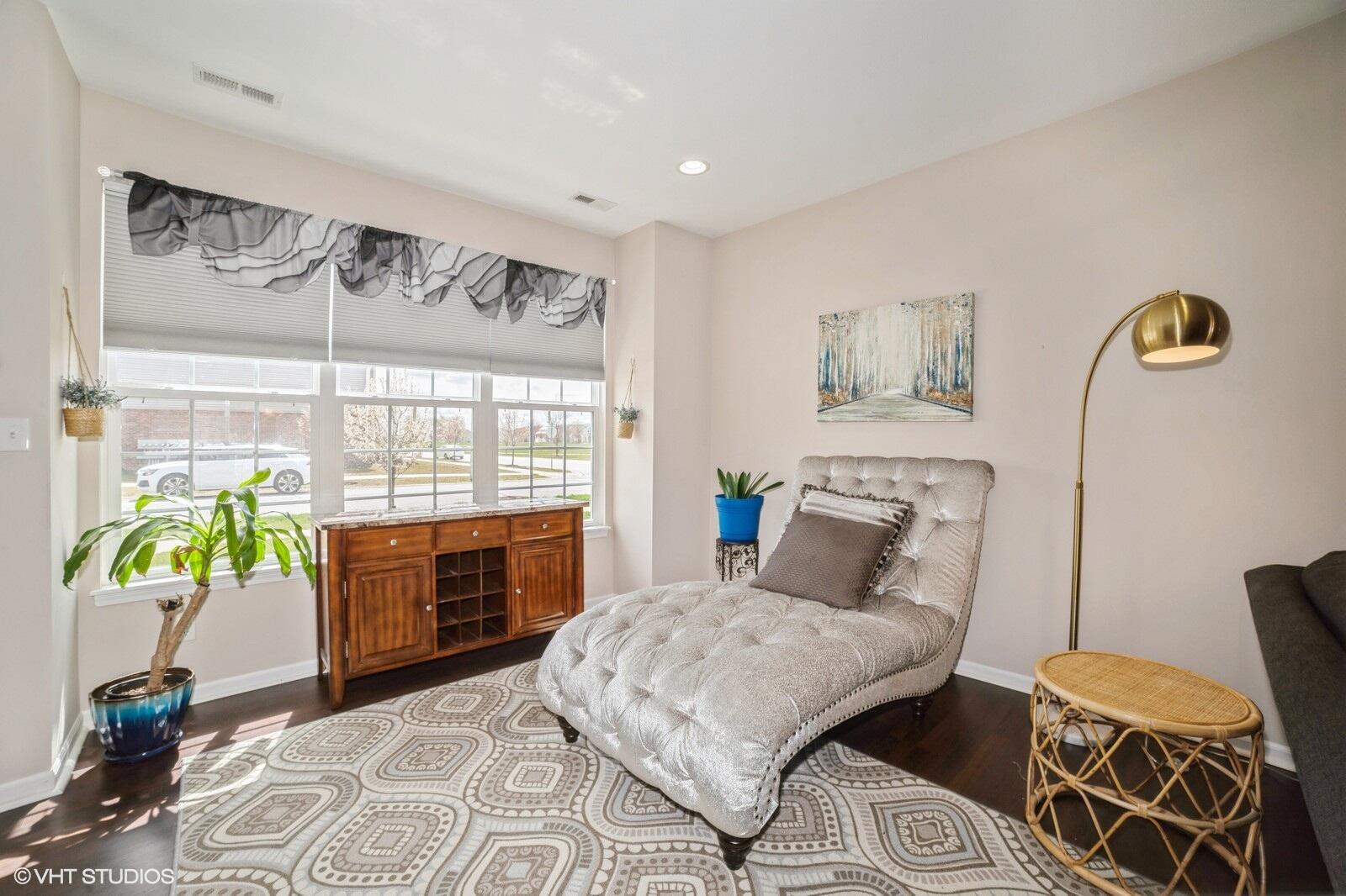 1078 East 114th Avenue Crown Point, IN 46307 - Photo 6 of 20 a bedroom with a bed and ceiling fan