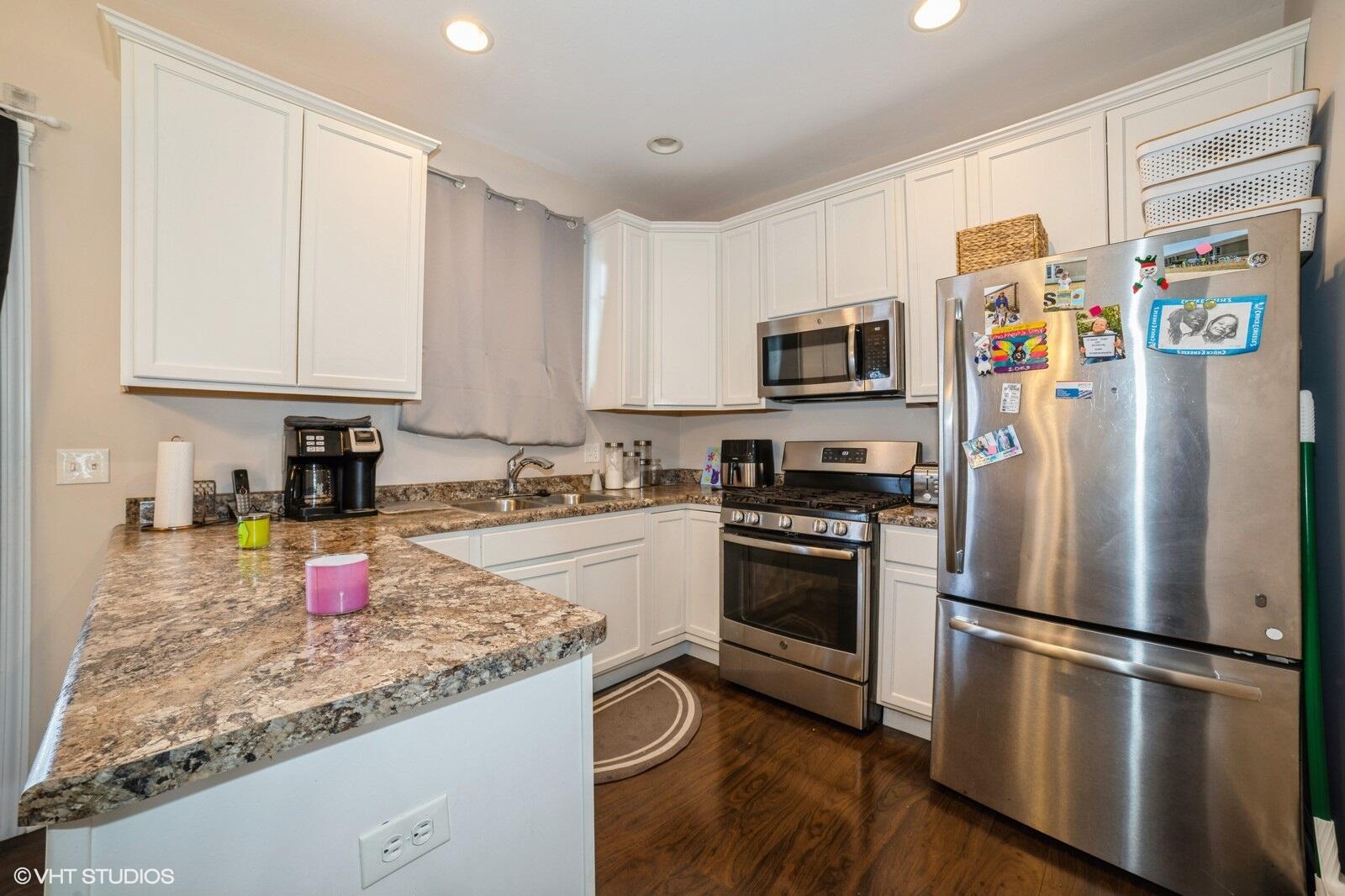 1078 East 114th Avenue Crown Point, IN 46307 - Photo 10 of 20 a kitchen with stainless steel appliances granite countertop a refrigerator sink and stove