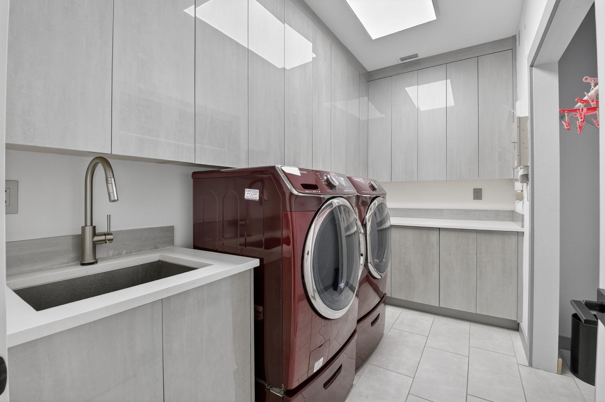 19787 Oakbrook Circle Boca Raton, FL 33434 - Photo 22 of 84 a utility room with sink dryer and washer