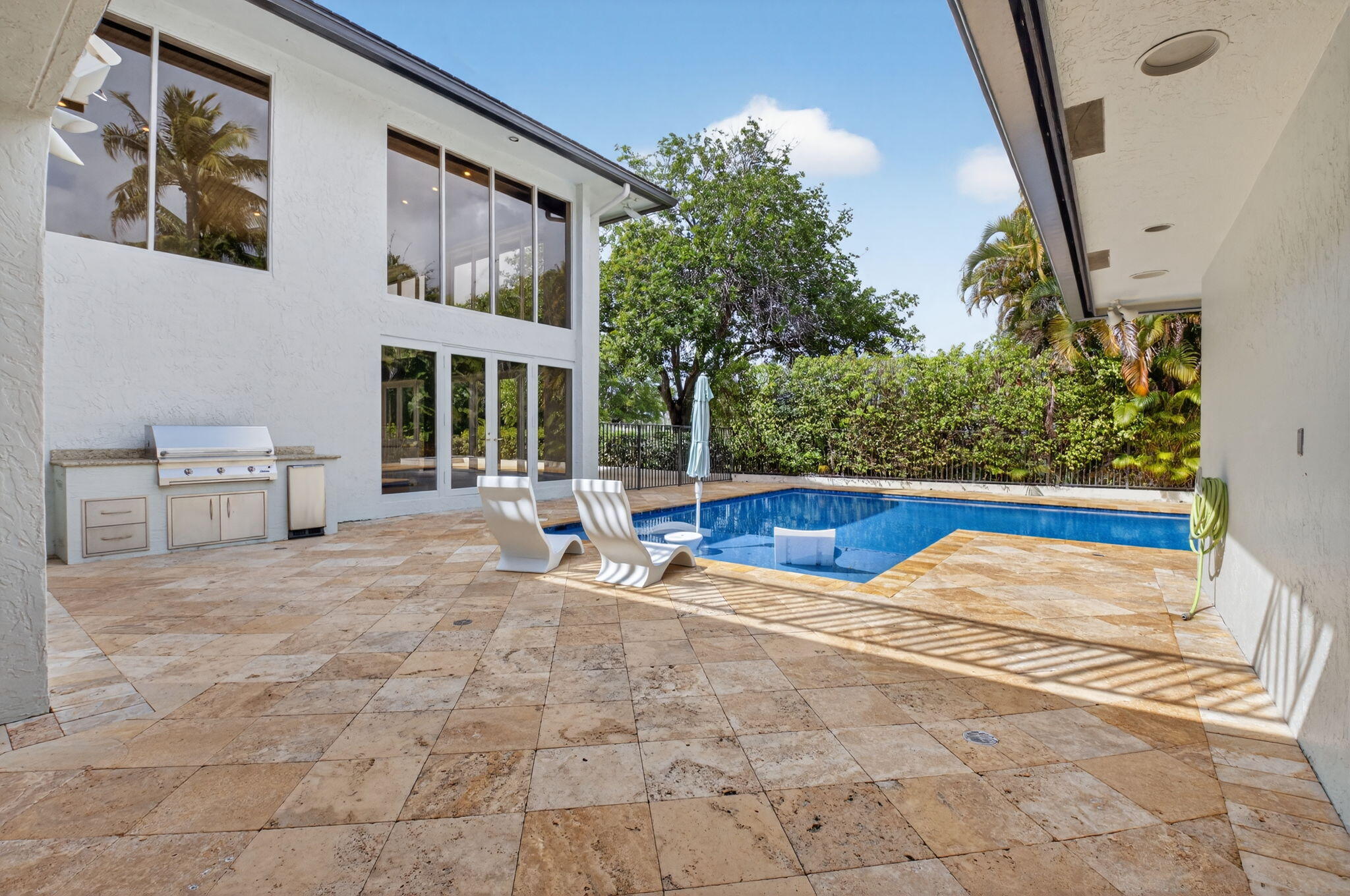 19787 Oakbrook Circle Boca Raton, FL 33434 - Photo 38 of 84 a view of swimming pool with lawn chairs and potted plants