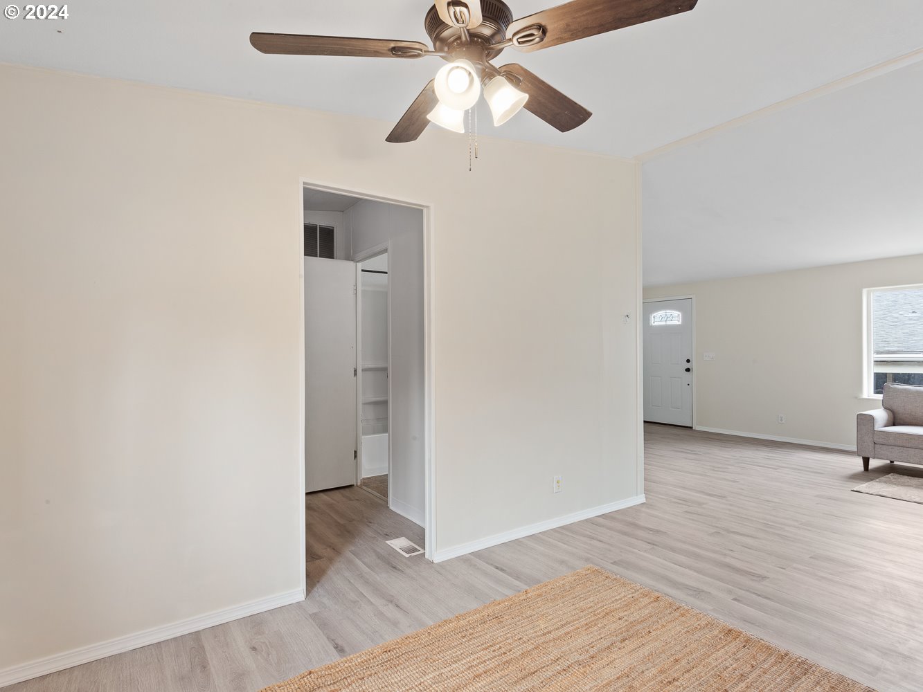 415 Northeast 194th Street, Unit 5 Ridgefield, WA 98642 - Photo 12 of 35 wooden floor in an empty room with a window