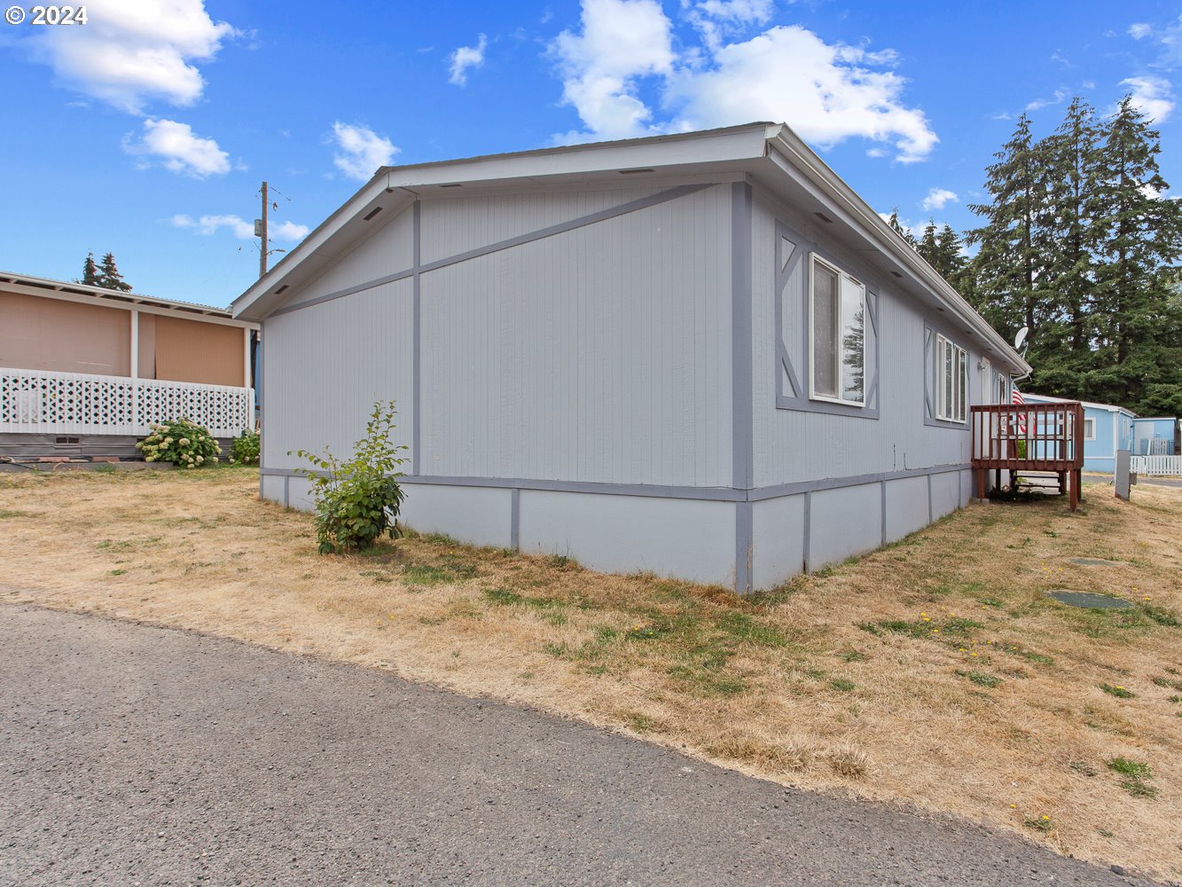 415 Northeast 194th Street, Unit 5 Ridgefield, WA 98642 - Photo 34 of 35 a view of a house with a yard