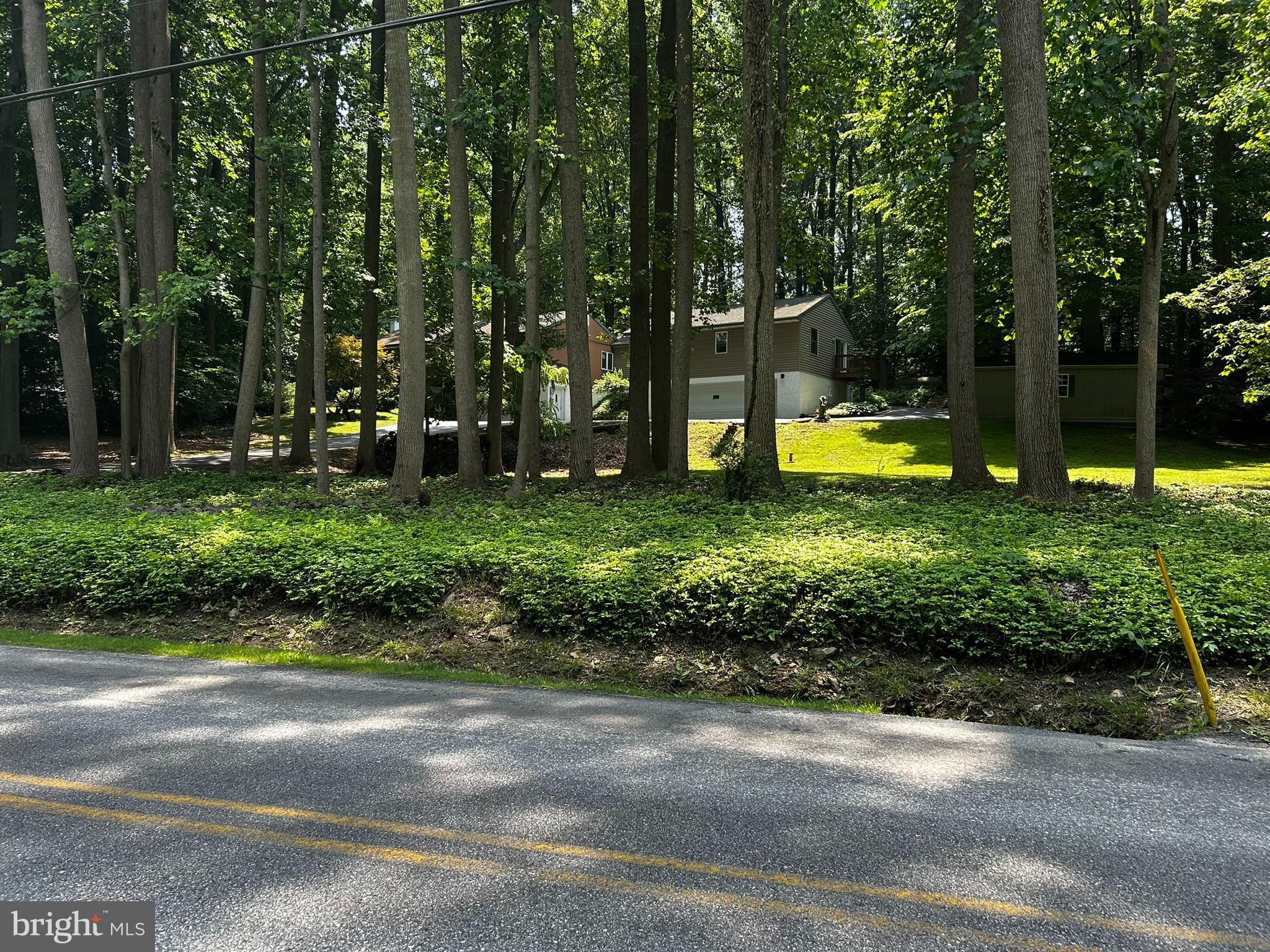 2140 Beaver Dam Road Honey Brook, PA 19344 - Photo 12 of 45 a view of a swimming pool with a sitting area and garden