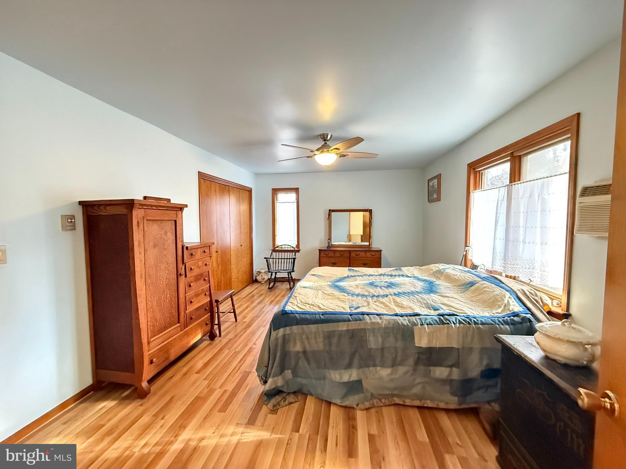 2140 Beaver Dam Road Honey Brook, PA 19344 - Photo 16 of 45 a bedroom with a bed and a dresser with mirror