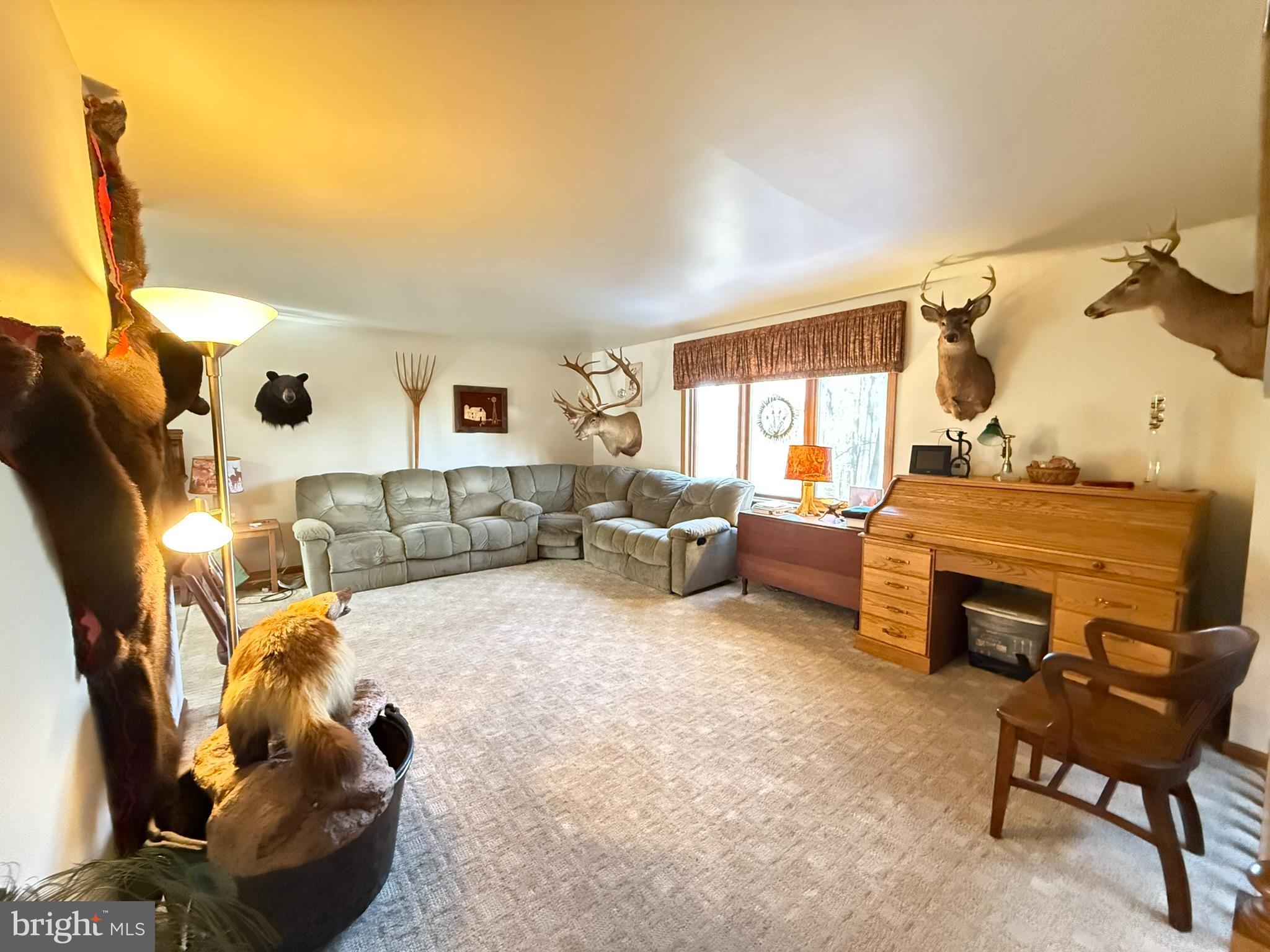 2140 Beaver Dam Road Honey Brook, PA 19344 - Photo 17 of 45 a living room with furniture and a flat screen tv