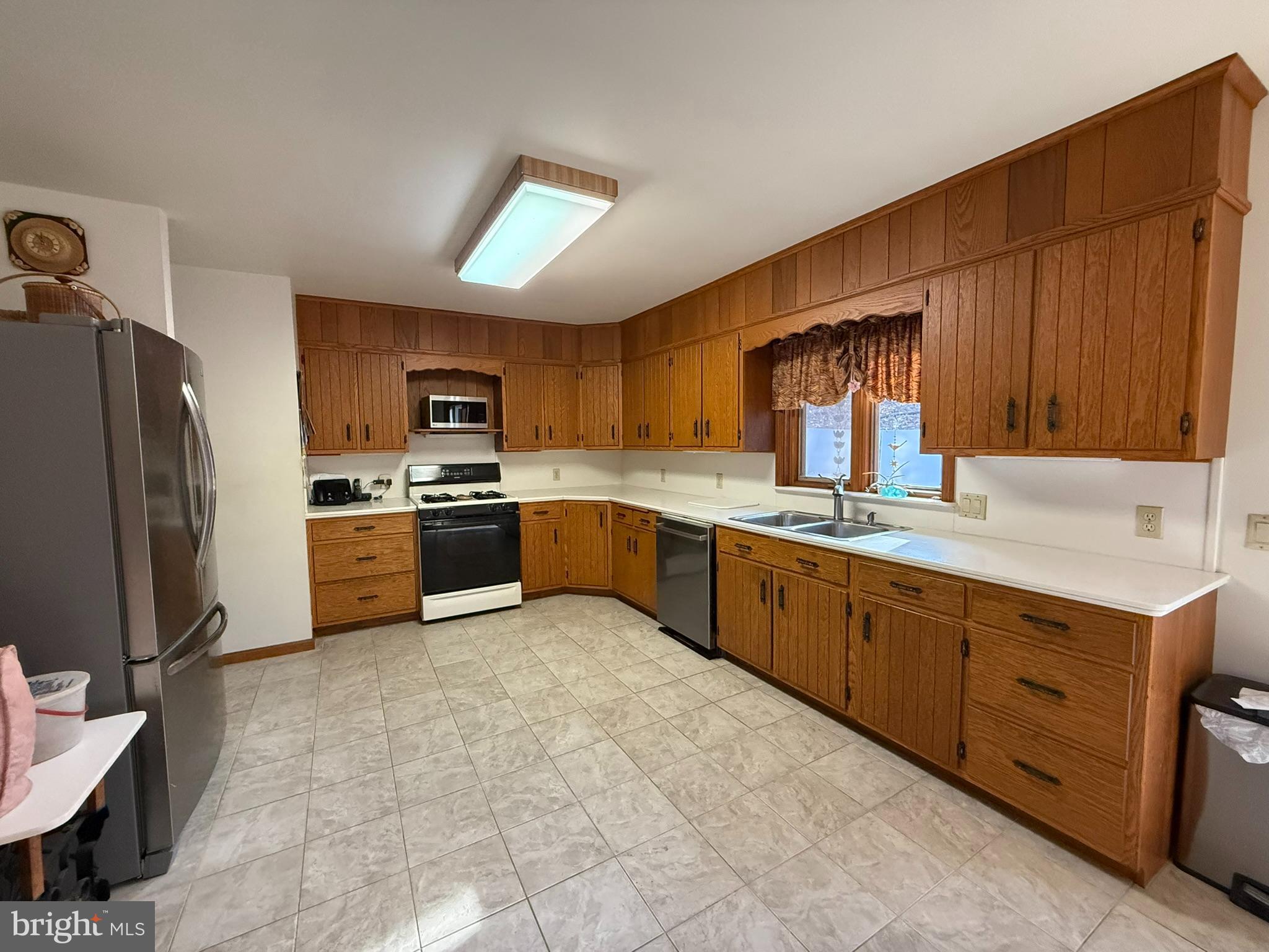 2140 Beaver Dam Road Honey Brook, PA 19344 - Photo 20 of 45 a kitchen with stainless steel appliances granite countertop a refrigerator sink and cabinets