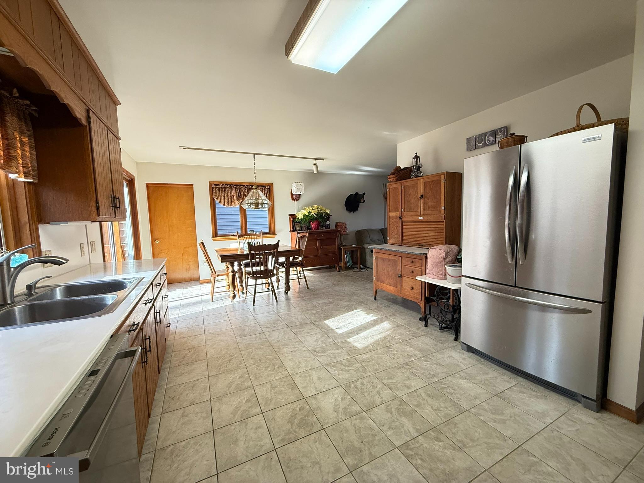 2140 Beaver Dam Road Honey Brook, PA 19344 - Photo 22 of 45 a kitchen with stainless steel appliances granite countertop a refrigerator and a sink