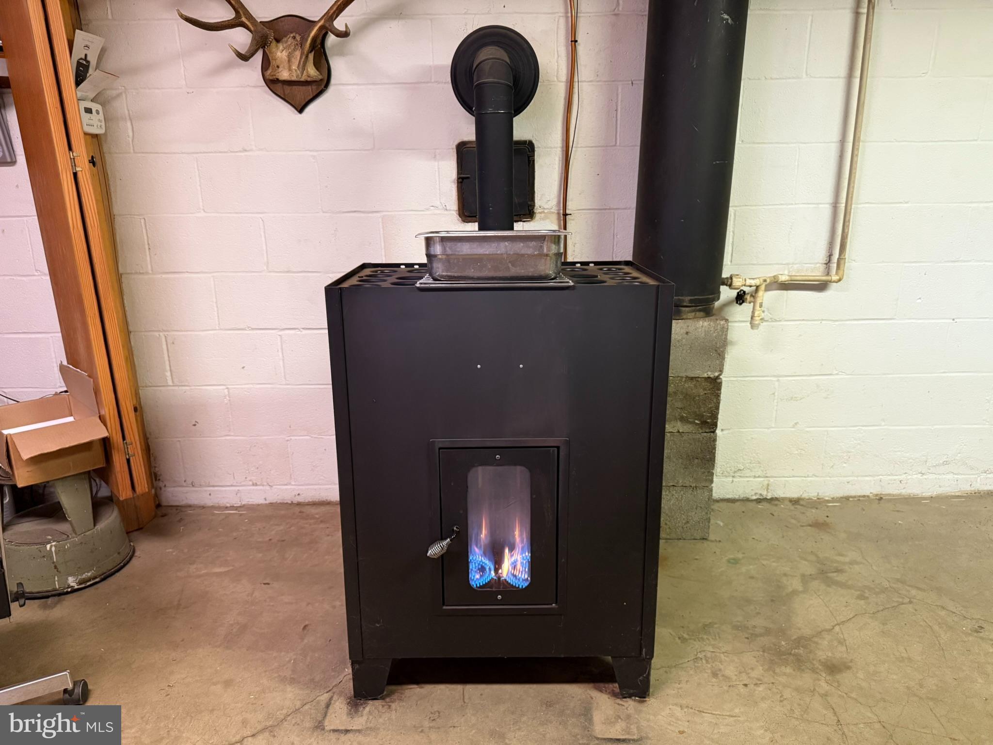 2140 Beaver Dam Road Honey Brook, PA 19344 - Photo 23 of 45 a living room with a fireplace and a flat screen tv