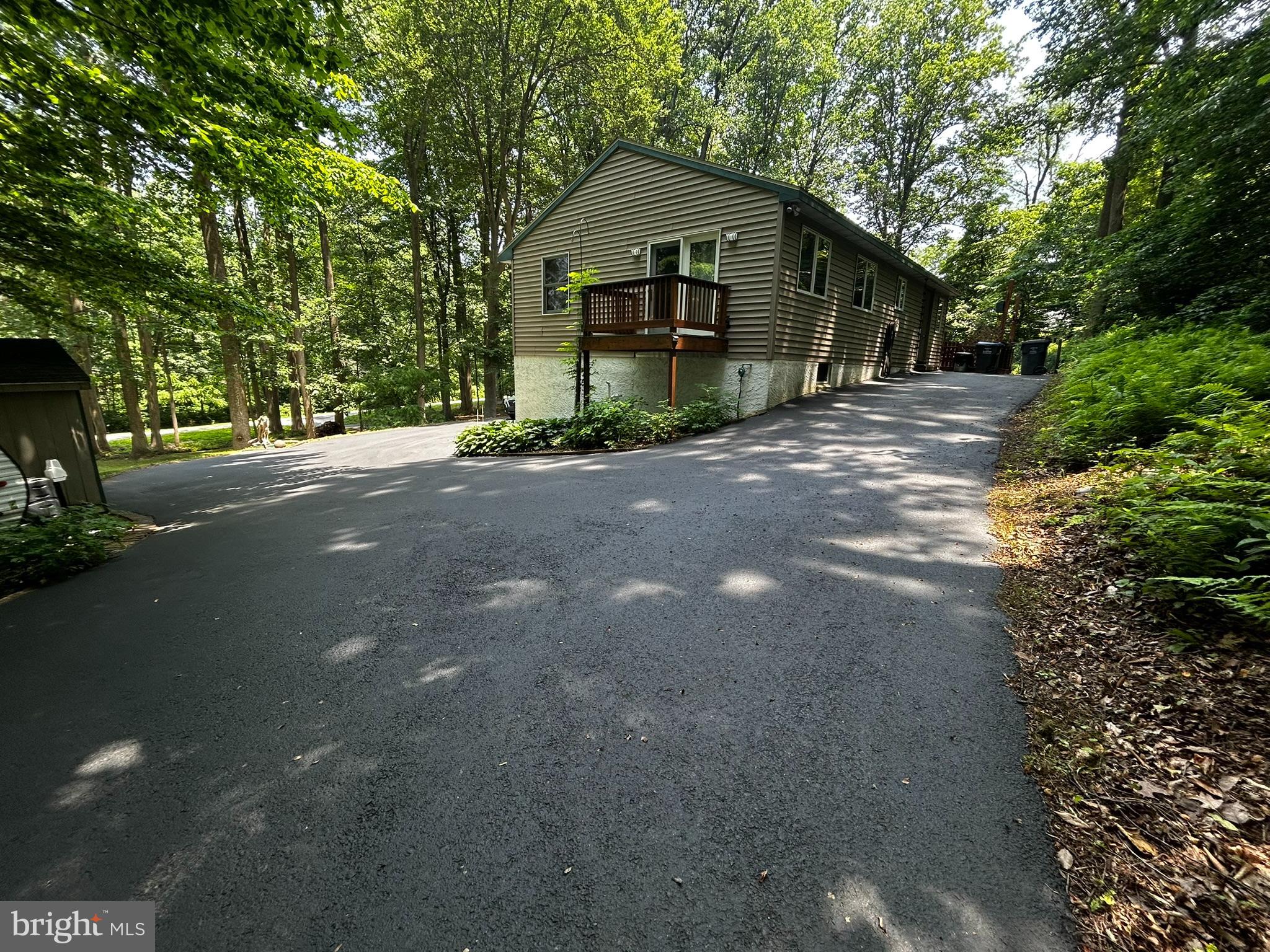 2140 Beaver Dam Road Honey Brook, PA 19344 - Photo 33 of 45 a front view of a house with a yard and garage