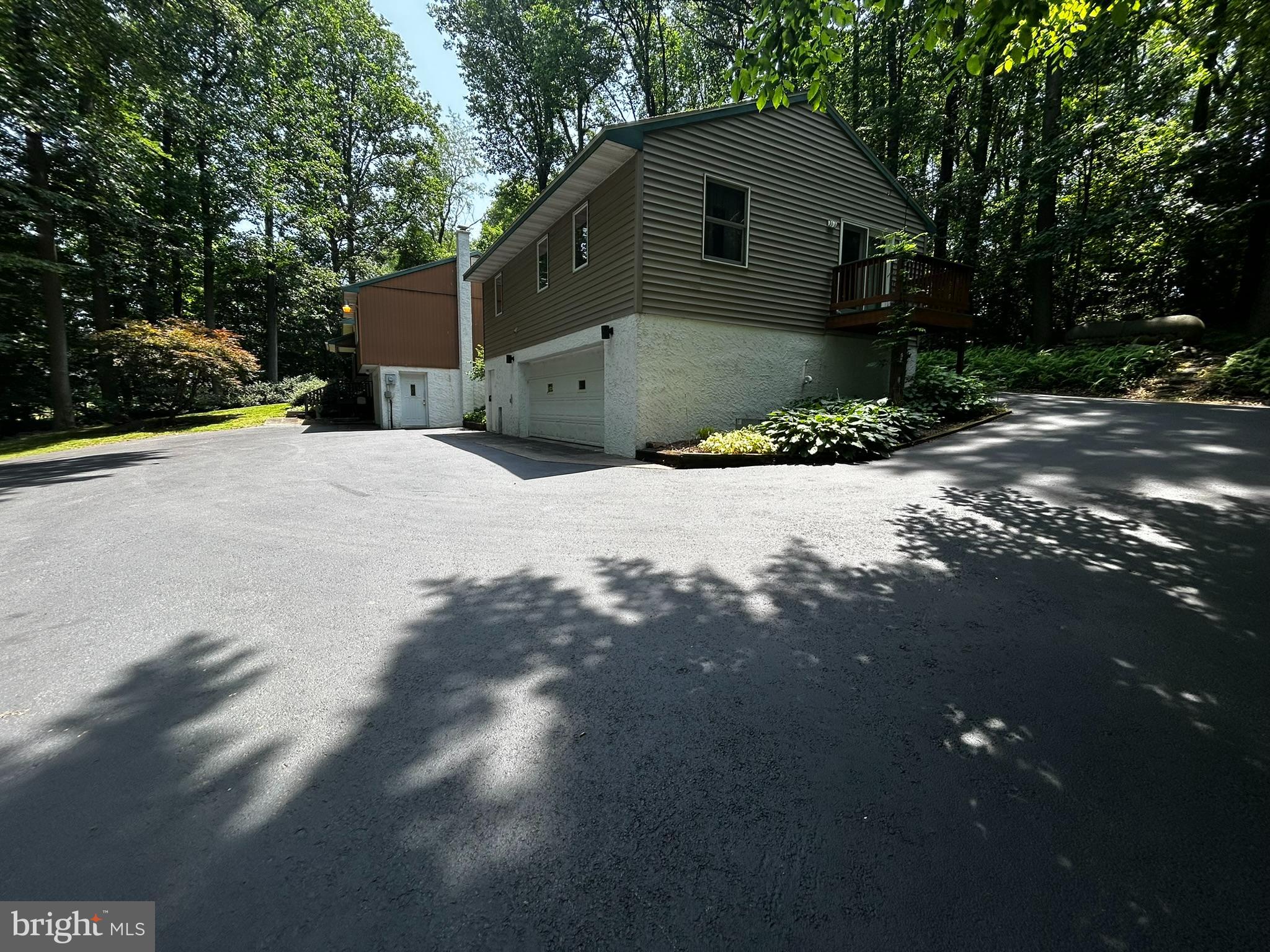 2140 Beaver Dam Road Honey Brook, PA 19344 - Photo 34 of 45 a front view of a house with a yard and garage
