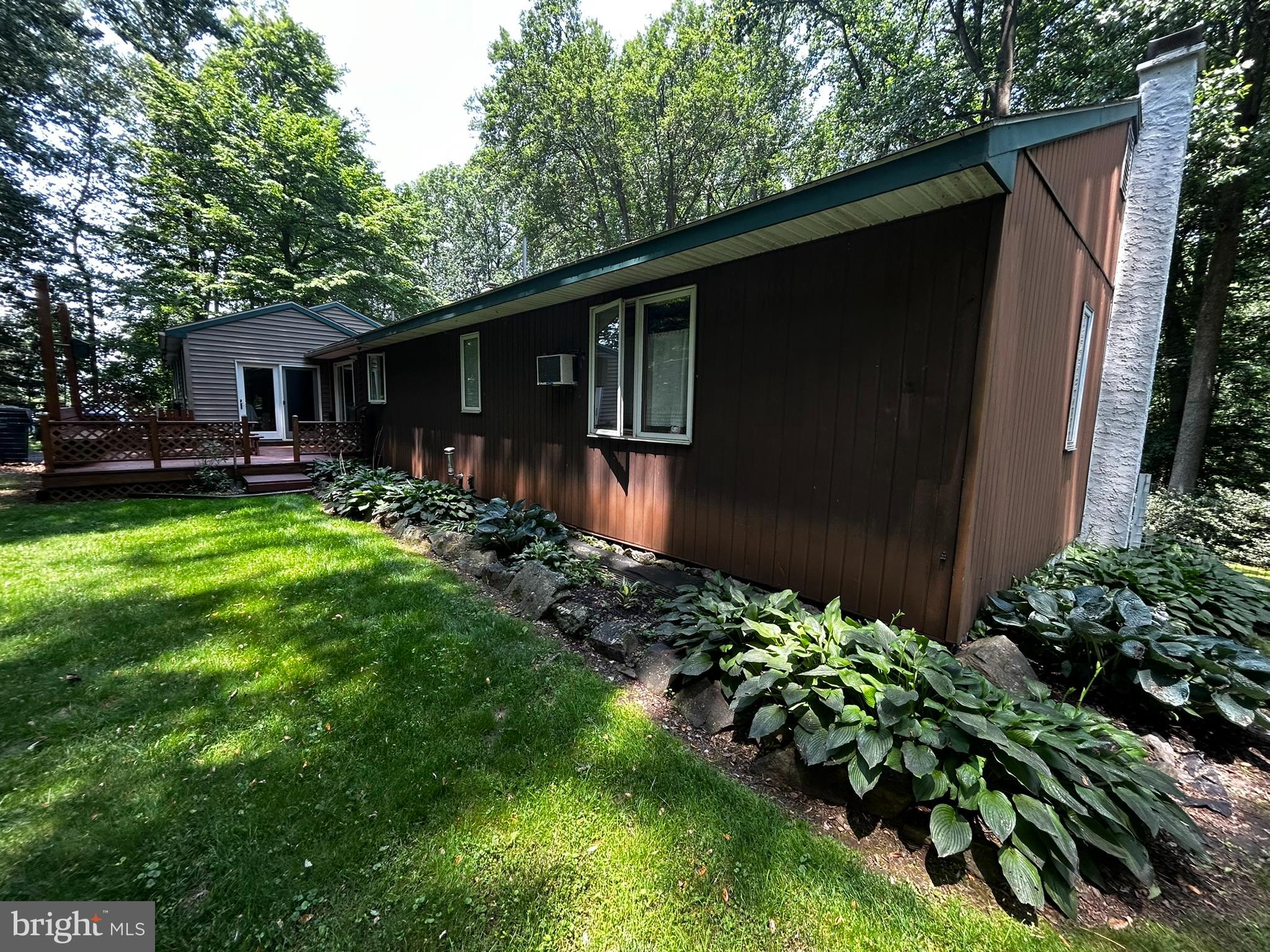 2140 Beaver Dam Road Honey Brook, PA 19344 - Photo 6 of 45 a backyard of a house with yard table and chairs