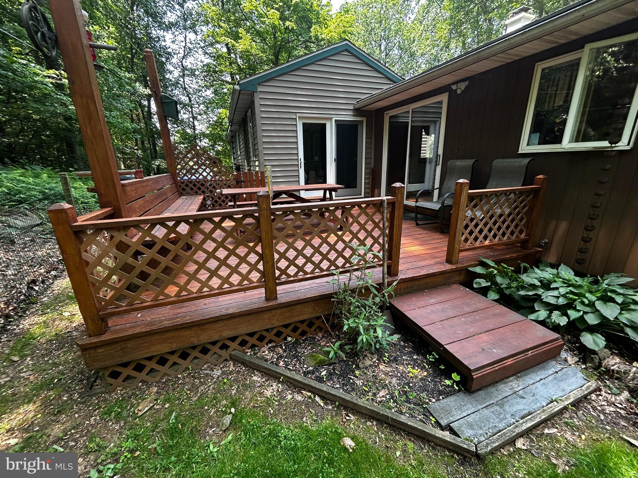 2140 Beaver Dam Road Honey Brook, PA 19344 - Photo 8 of 45 a view of a wooden bench in back yard of a house