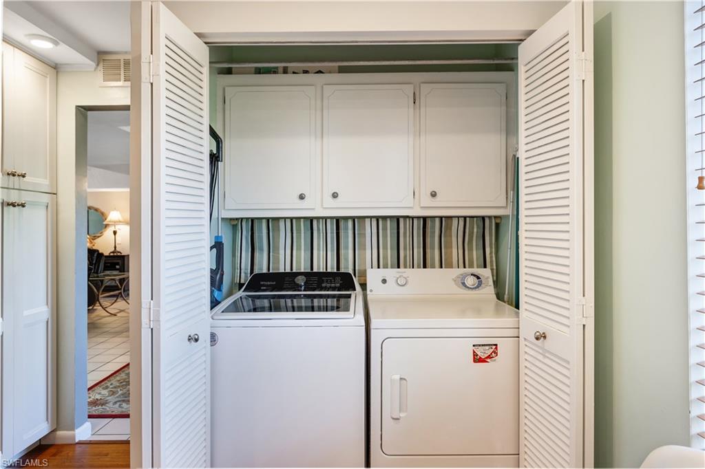 154 Penny Lane, Unit 7 Naples, FL 34112 - Photo 11 of 50 a utility room with dryer and washer