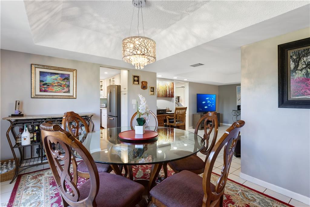 154 Penny Lane, Unit 7 Naples, FL 34112 - Photo 12 of 50 a view of a dining room with furniture