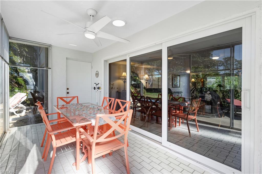 154 Penny Lane, Unit 7 Naples, FL 34112 - Photo 32 of 50 a outdoor space with furniture