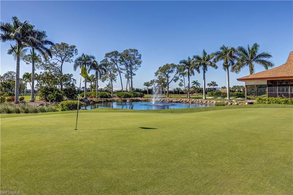 154 Penny Lane, Unit 7 Naples, FL 34112 - Photo 38 of 50 a swimming pool with outdoor seating and yard