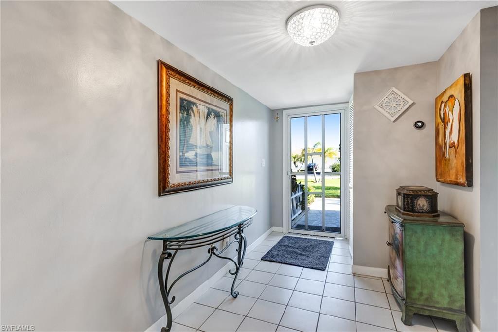 154 Penny Lane, Unit 7 Naples, FL 34112 - Photo 4 of 50 a view of an entryway with furniture