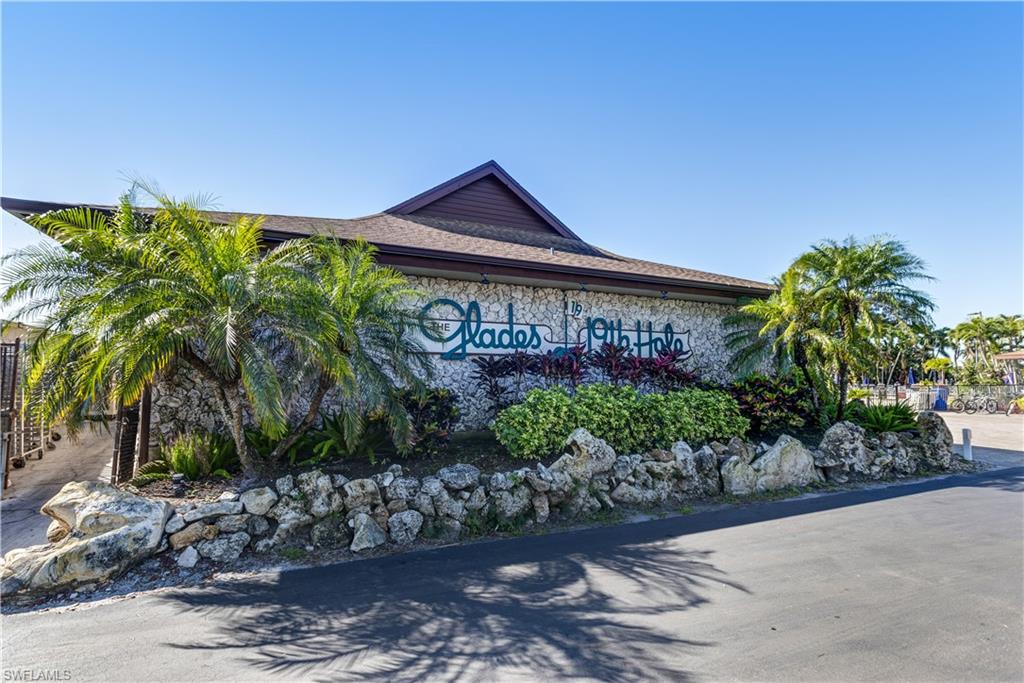 154 Penny Lane, Unit 7 Naples, FL 34112 - Photo 41 of 50 a sign on the side of a street