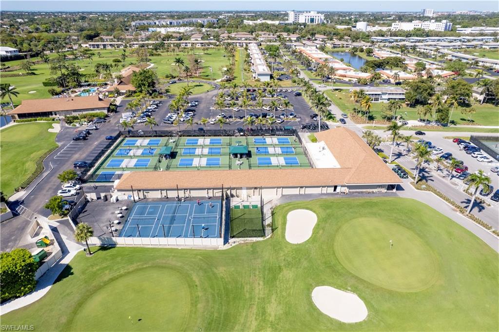 154 Penny Lane, Unit 7 Naples, FL 34112 - Photo 45 of 50 an aerial view of residential houses with outdoor space