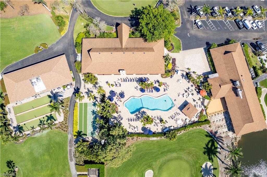 154 Penny Lane, Unit 7 Naples, FL 34112 - Photo 46 of 50 an aerial view of a house with a swimming pool yard and lake view