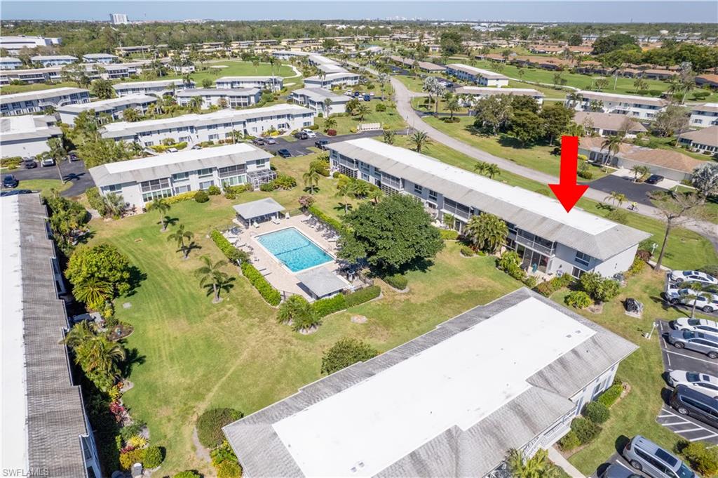 154 Penny Lane, Unit 7 Naples, FL 34112 - Photo 50 of 50 an aerial view of residential houses with outdoor space