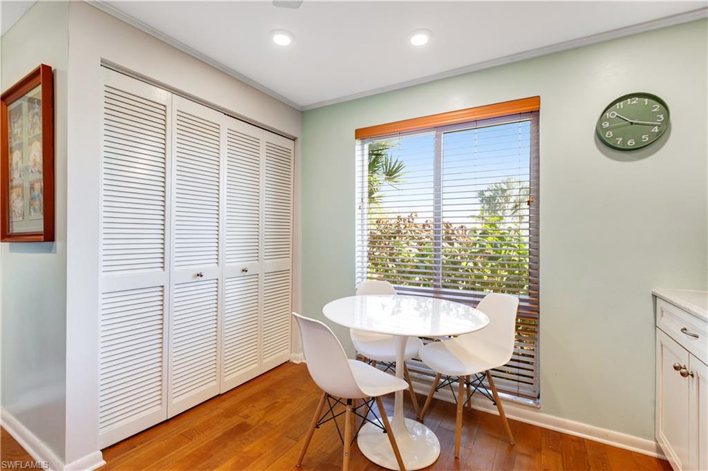 154 Penny Lane, Unit 7 Naples, FL 34112 - Photo 10 of 50 a view of a room with furniture wooden floor and front door