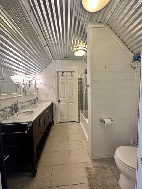 7470 Smith Chapel Road Cookeville, TN 38501 - Photo 22 of 70 a bathroom with a sink a toilet and shower