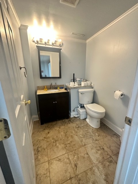 7470 Smith Chapel Road Cookeville, TN 38501 - Photo 36 of 70 a bathroom with a sink toilet and mirror