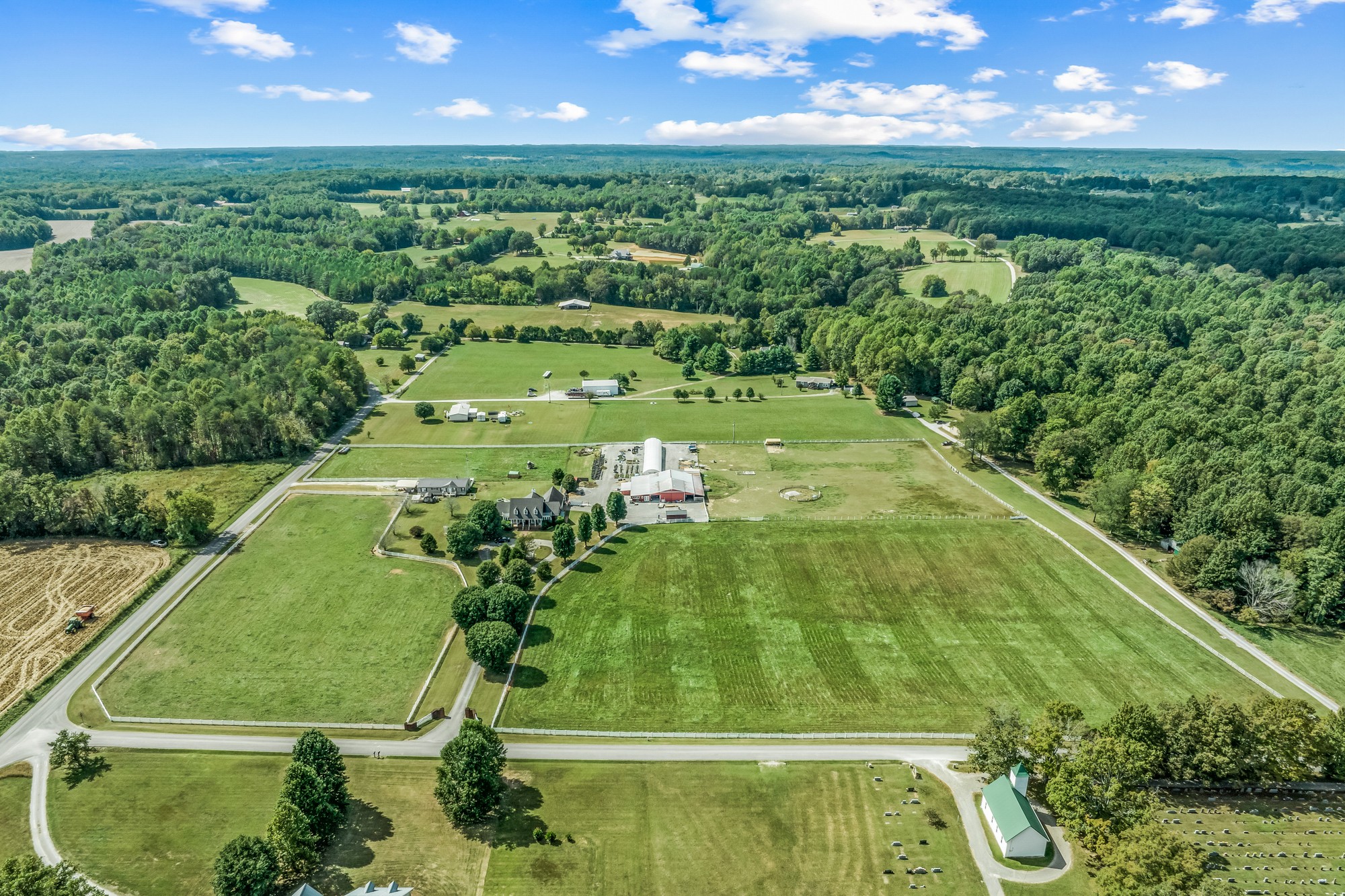 7470 Smith Chapel Road Cookeville, TN 38501 - Photo 53 of 70 a view of a back yard of a house with a garden and outdoor seating