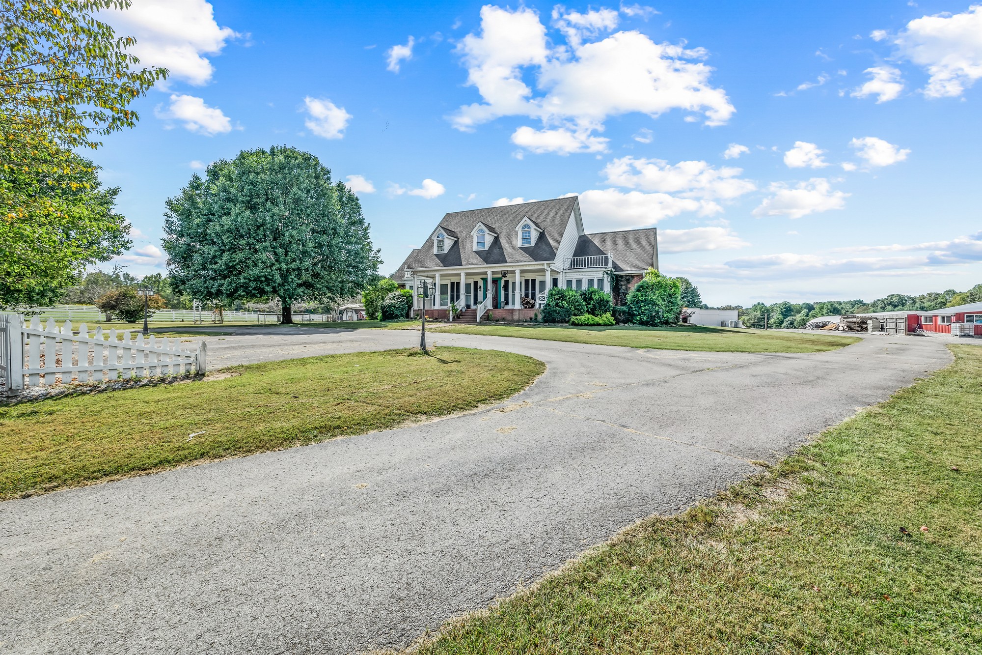 7470 Smith Chapel Road Cookeville, TN 38501 - Photo 7 of 70 a view of a house with a big yard and a large tree